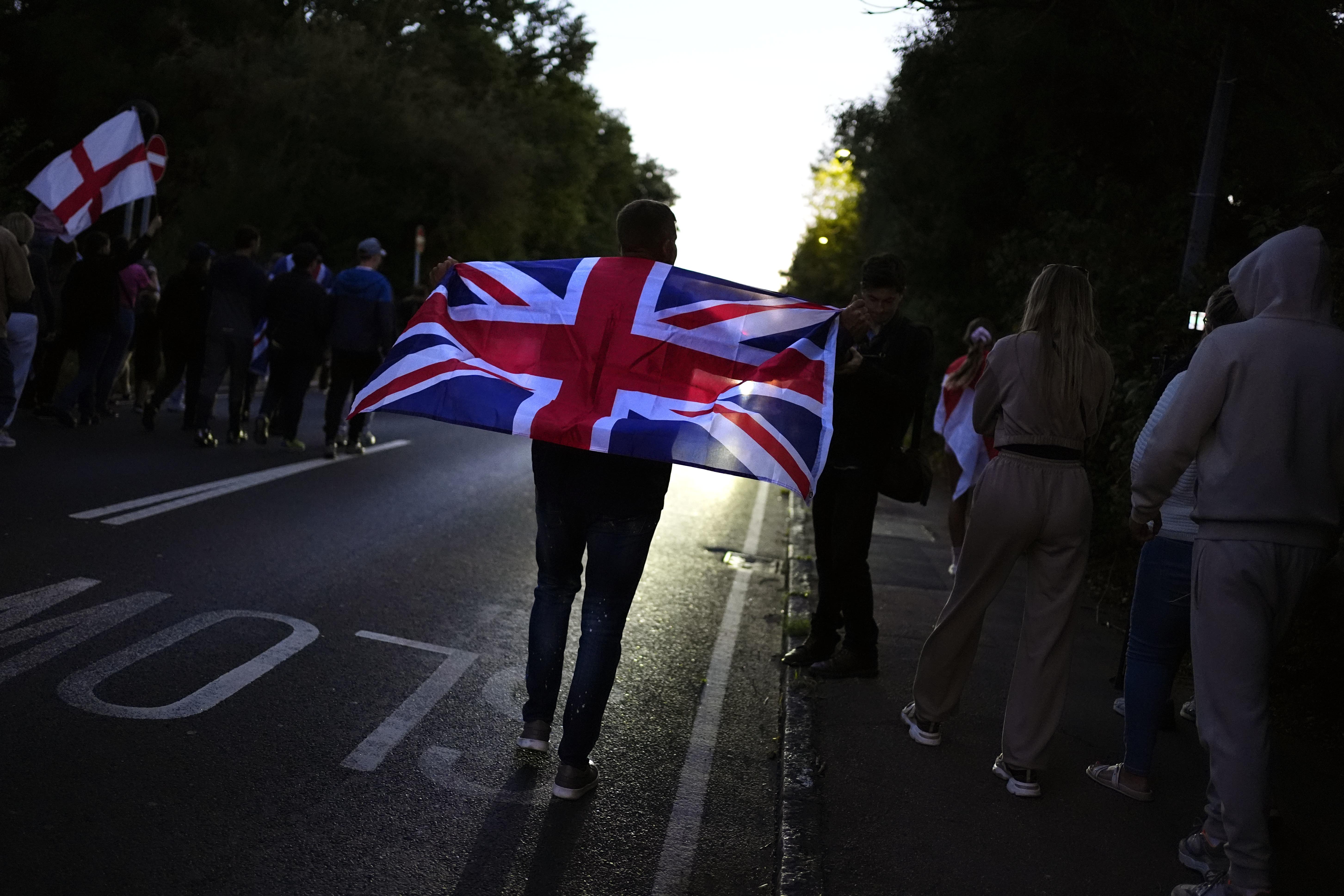 Protesters marching in Epping, Essex after a temporary injunction that would have blocked asylum seekers from being housed at the Bell Hotel, was overturned at the Court of Appeal (Jordan Pettitt/PA)