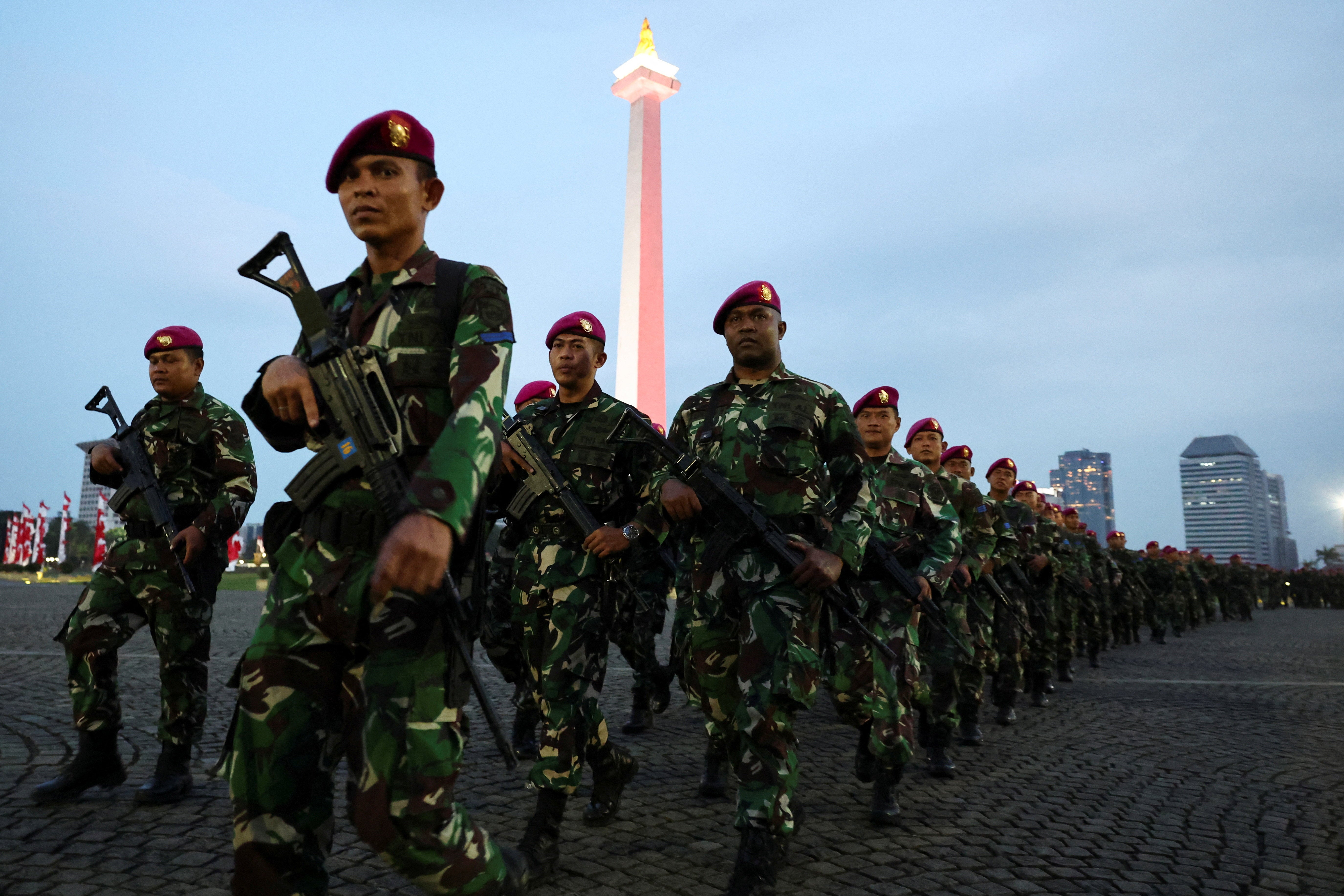 Armed Indonesian military troops march at the National Monument (Monas) complex as they prepare for deployment amid the widespread anti-government protests and rioting over issues such as extra pay for parliamentarians and housing allowances led by a student group that resulted in riots rocking Southeast Asia's largest economy, in Jakarta, Indonesia, 31 August 2025