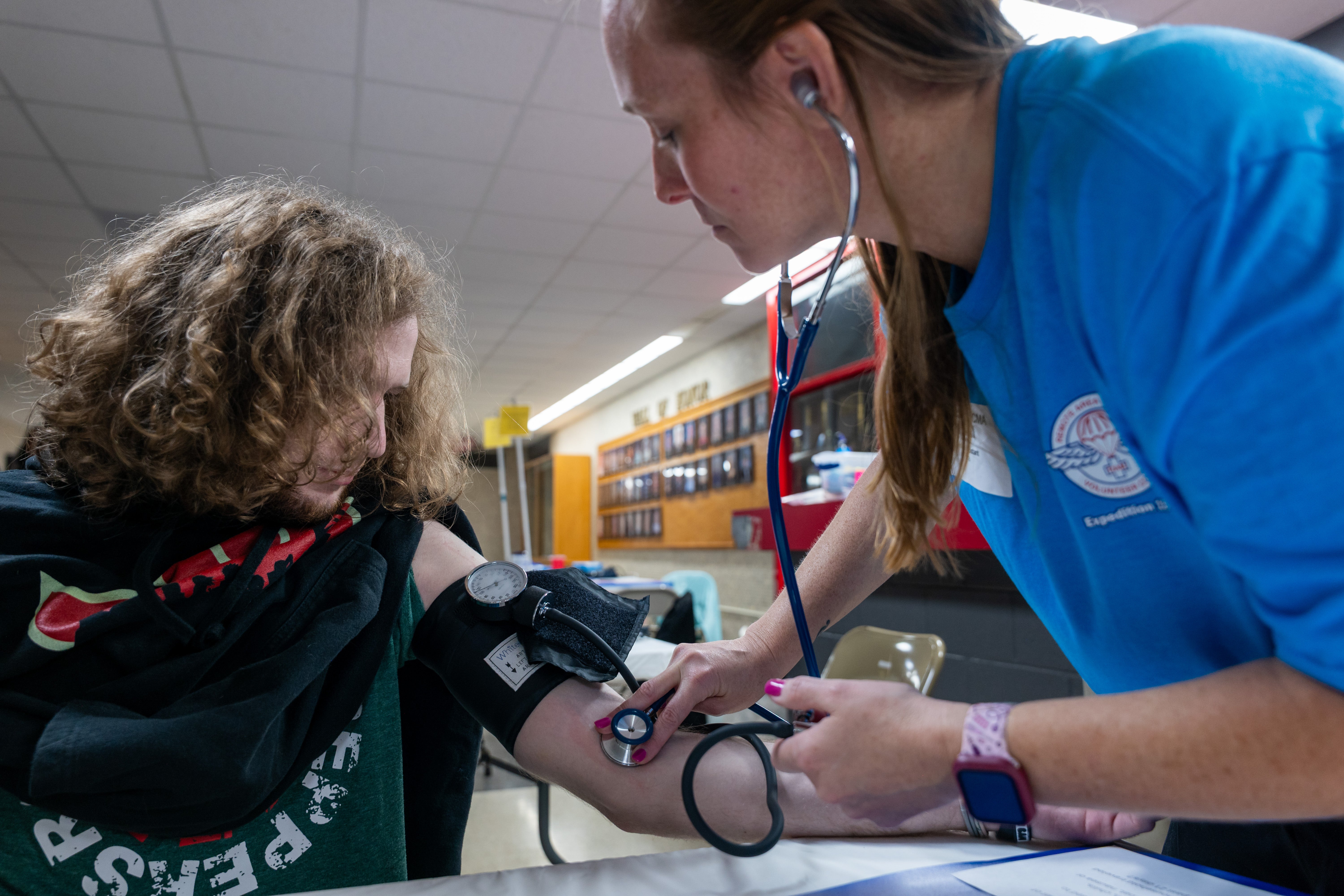 Tyler Williams, who currently doesn't have dental insurance, has his blood pressure checked at a Remote Area Medical (RAM) mobile dental and medical clinic at Terre Haute South High School on August 02, 2025 in Terre Haute, Indiana