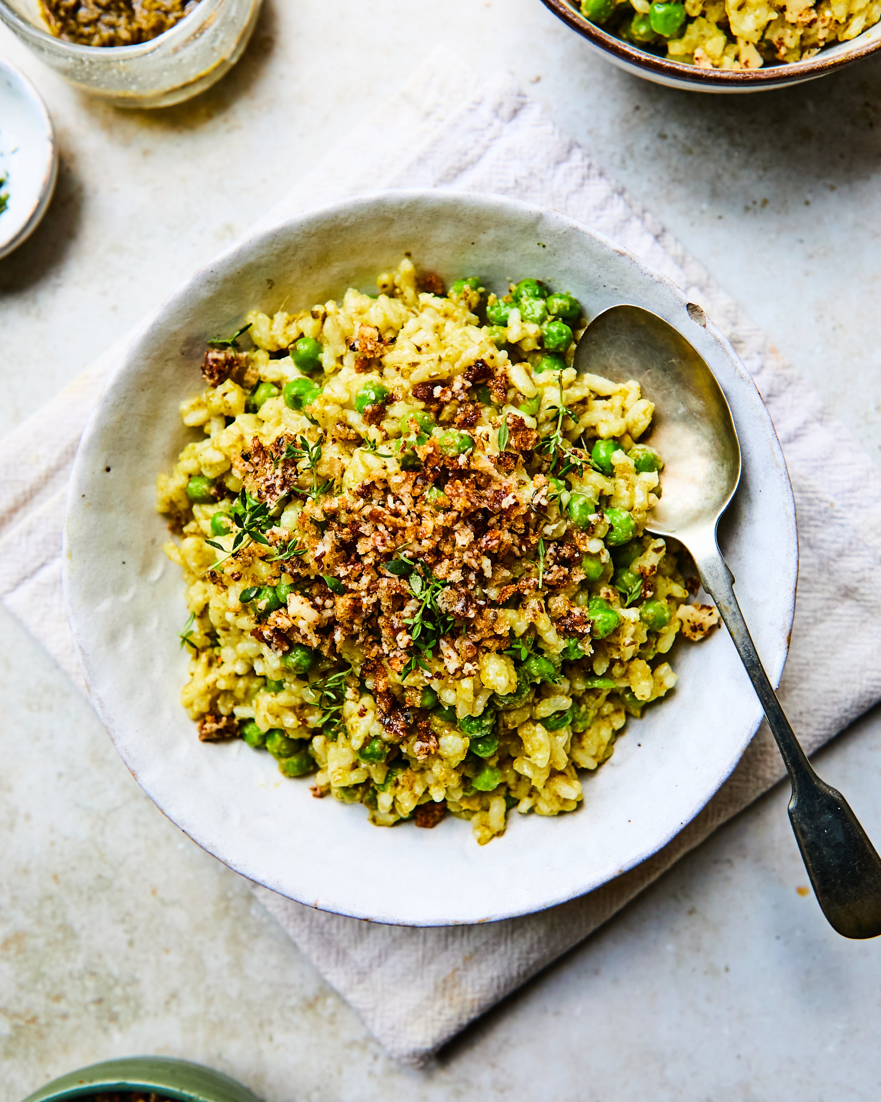 Comfort food with a twist: pesto and peas stirred through velvety carnaroli, finished with a golden, cheesy crunch