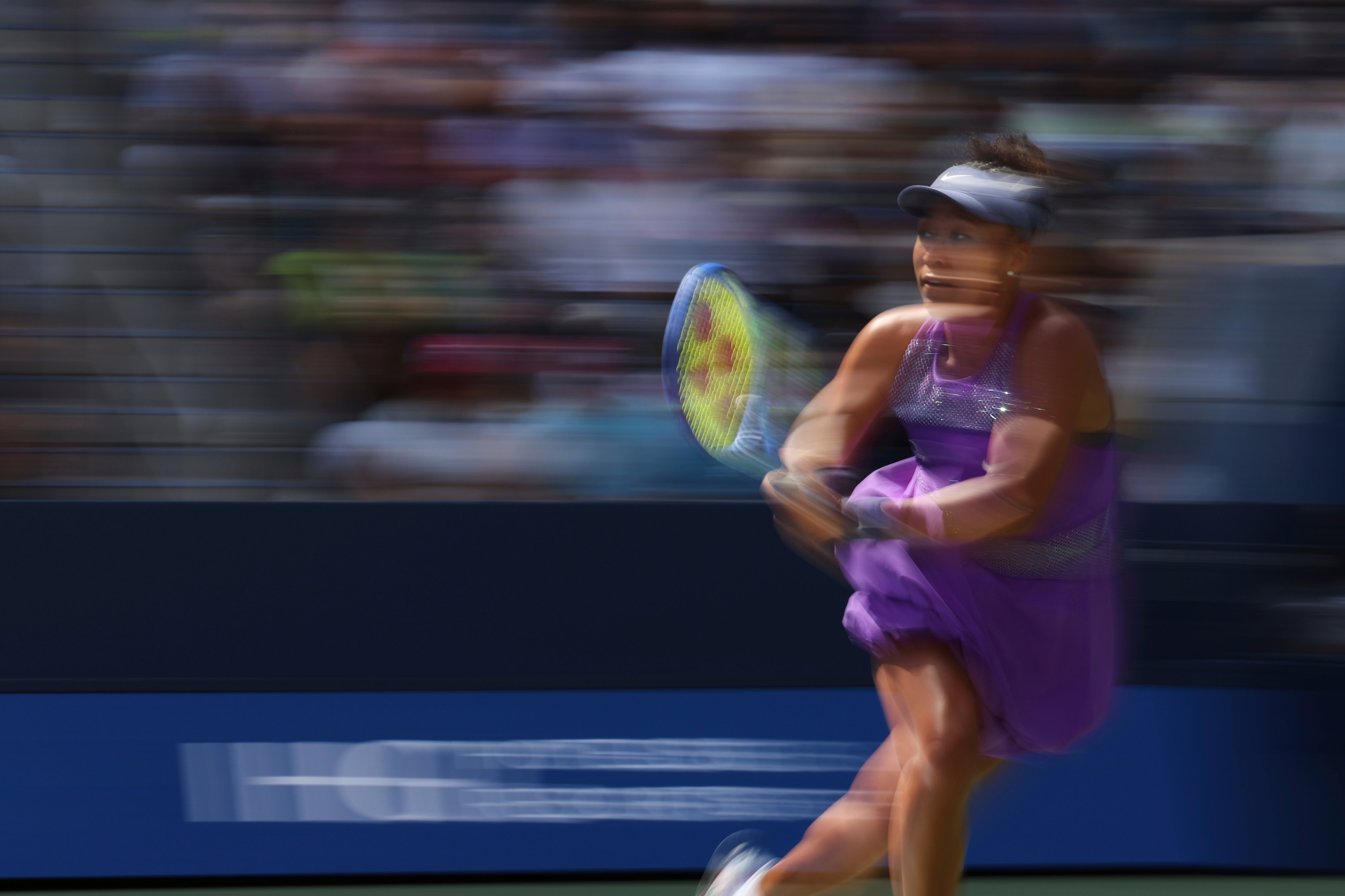 Naomi Osaka returns a shot against Daria Kasatkina, of Australia, during the third round of the U.S. Open tennis championships, Saturday, Aug. 30, 2025, in New York