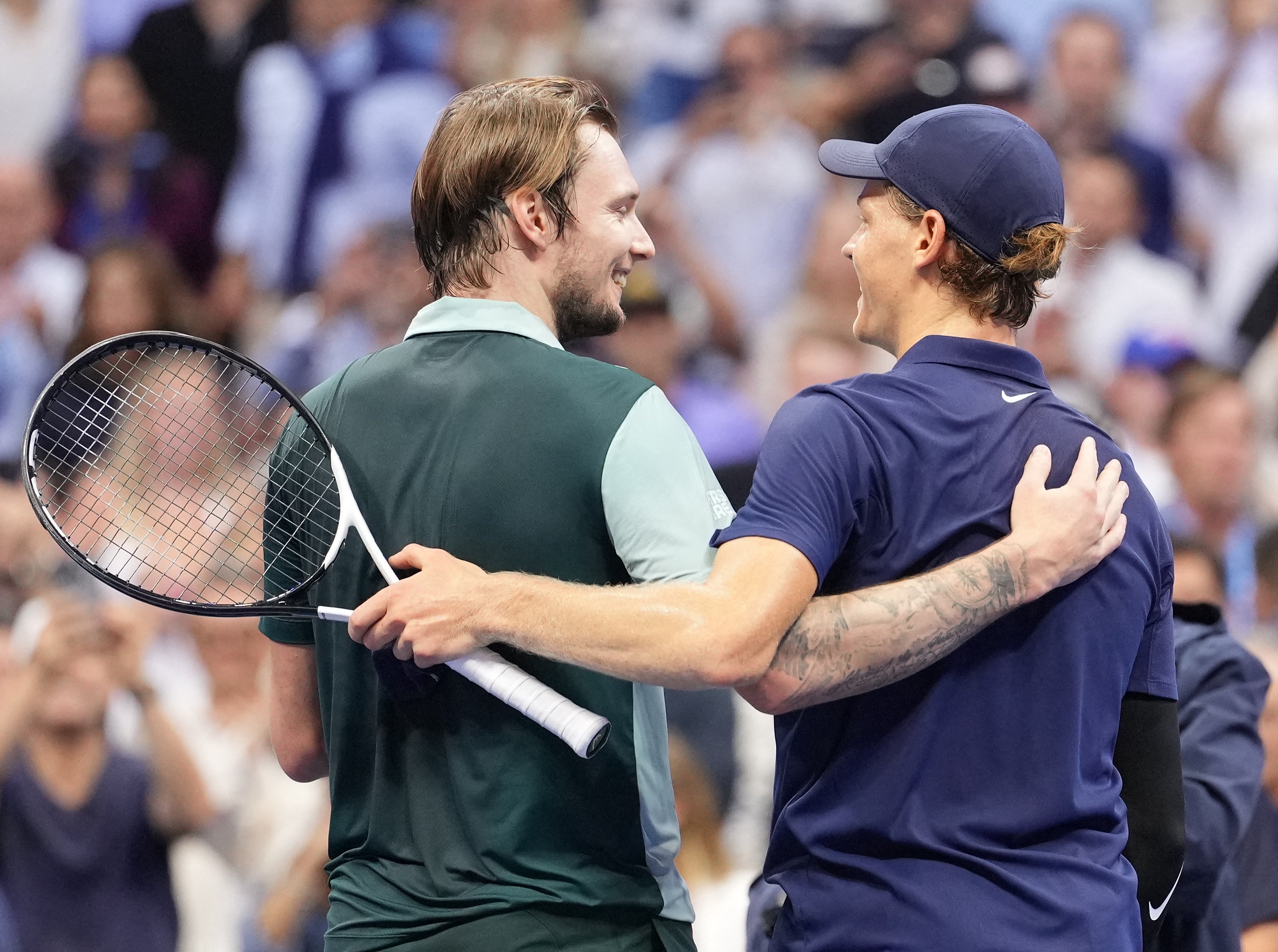 Alexander Bublik jokes with Jannik Sinner after his heavy defeat in the US Open fourth round