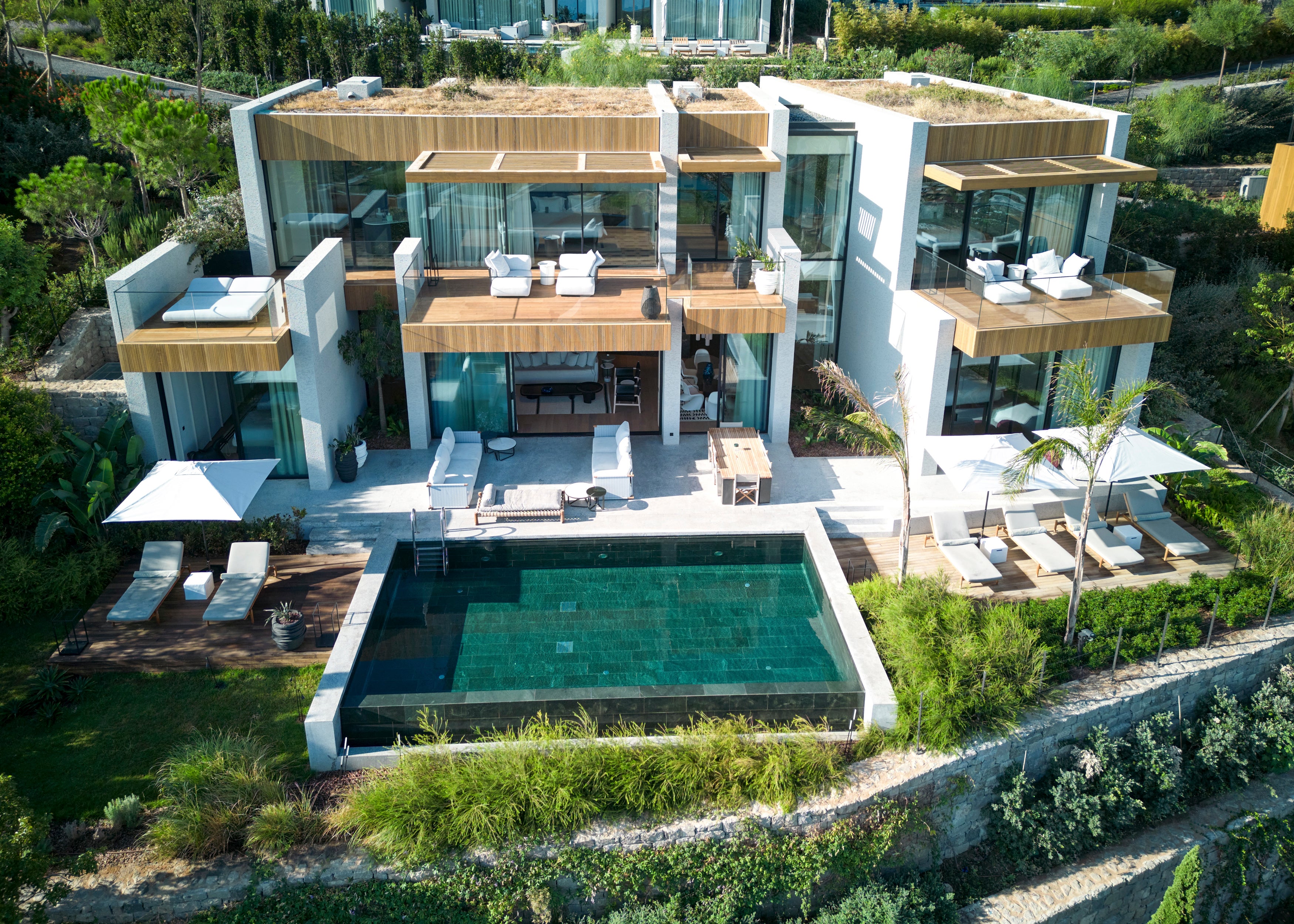Striking contemporary villas arise from the natural surroundings here at Maxx Royal Bodrum Resort