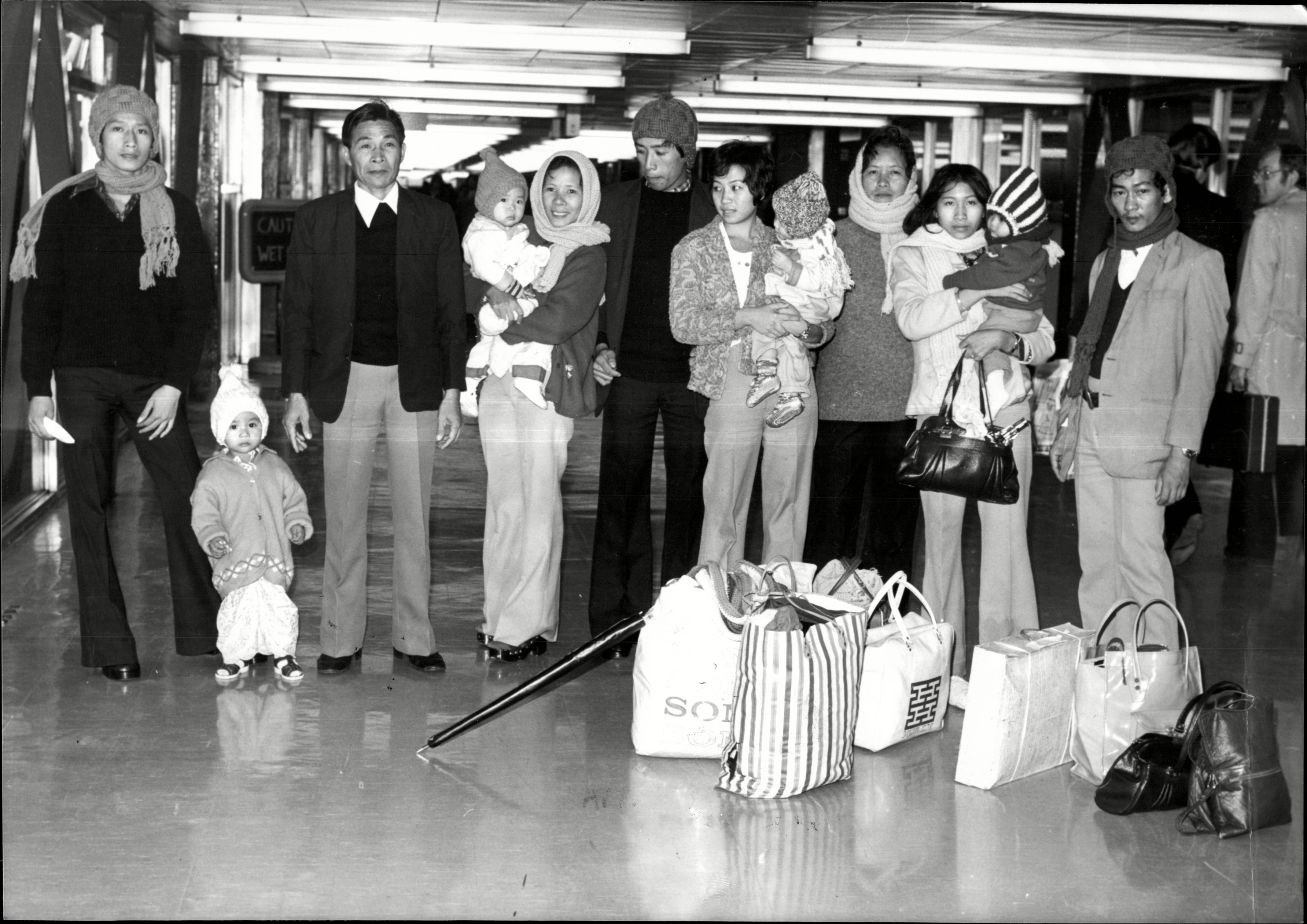 Vietnamese refugees fleeing war arrive at Heathrow