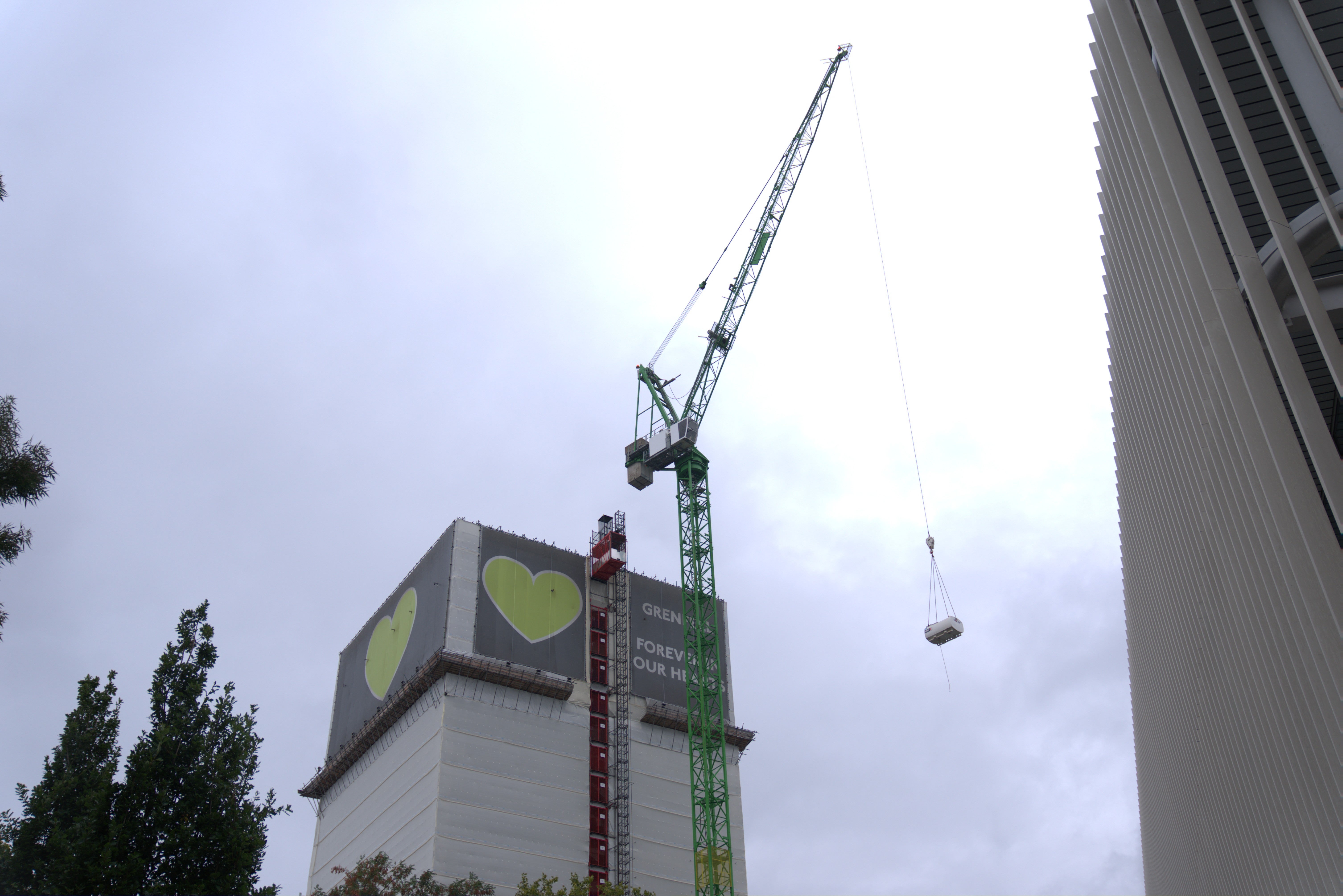 A crane is seen over the Grenfell Tower in west London where demolition work is set to get under way (Ben Whitley/PA)