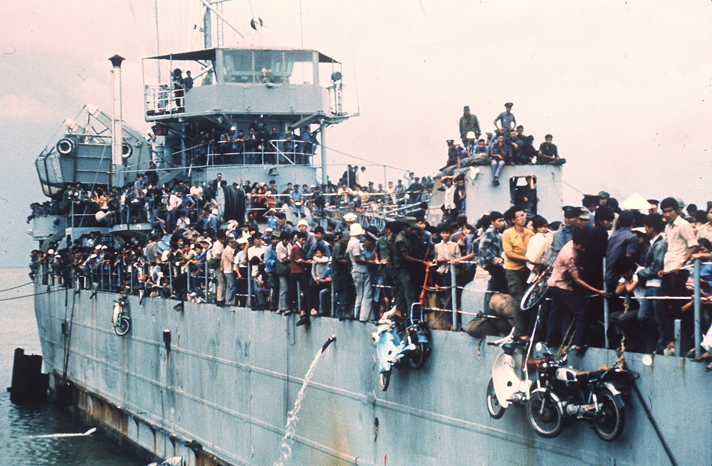 A navy ship in Vietnam carrying thousands of refugees