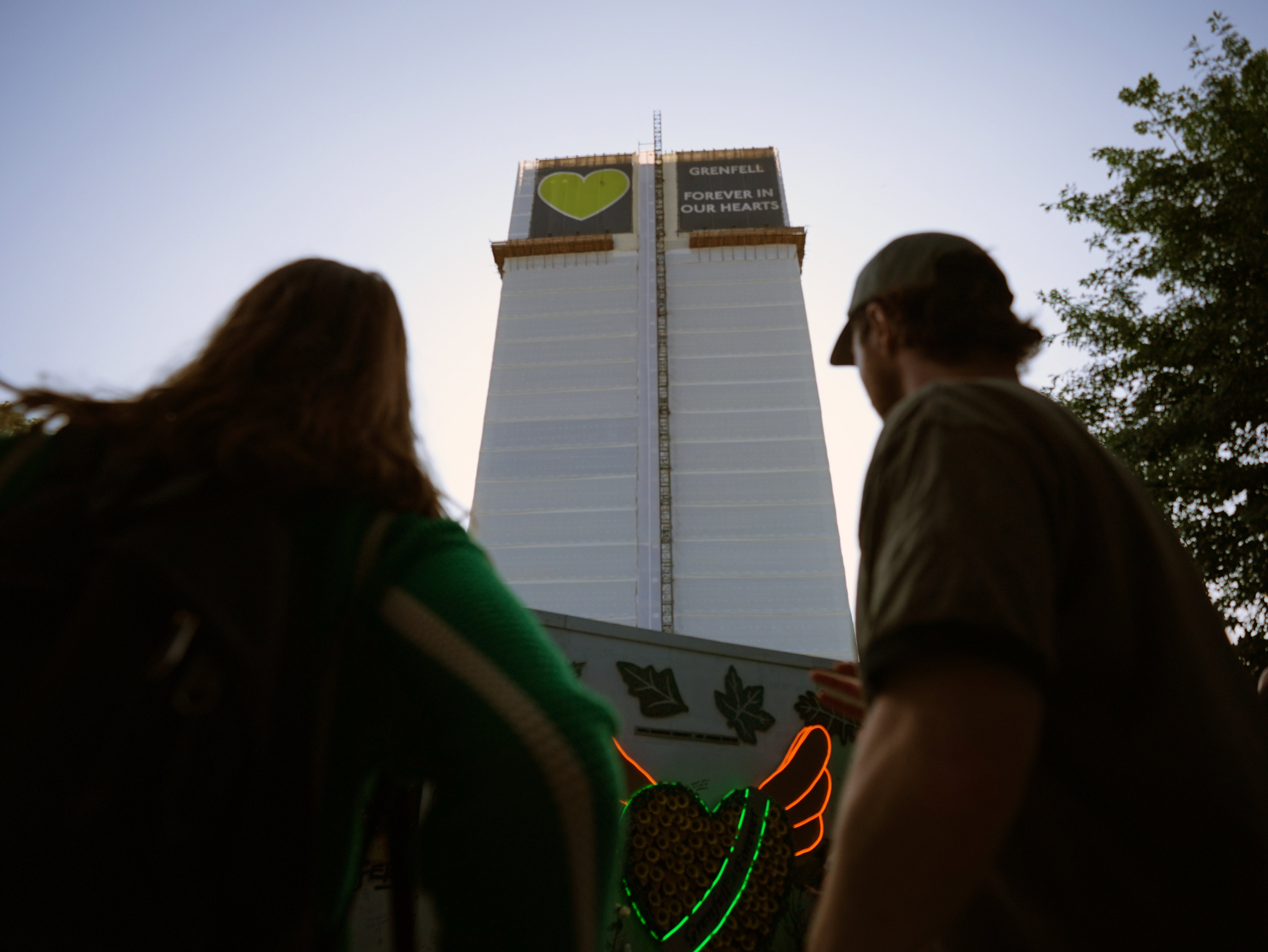 People at Grenfell Tower in June, on the eighth anniversary of the fire (James Manning/PA)