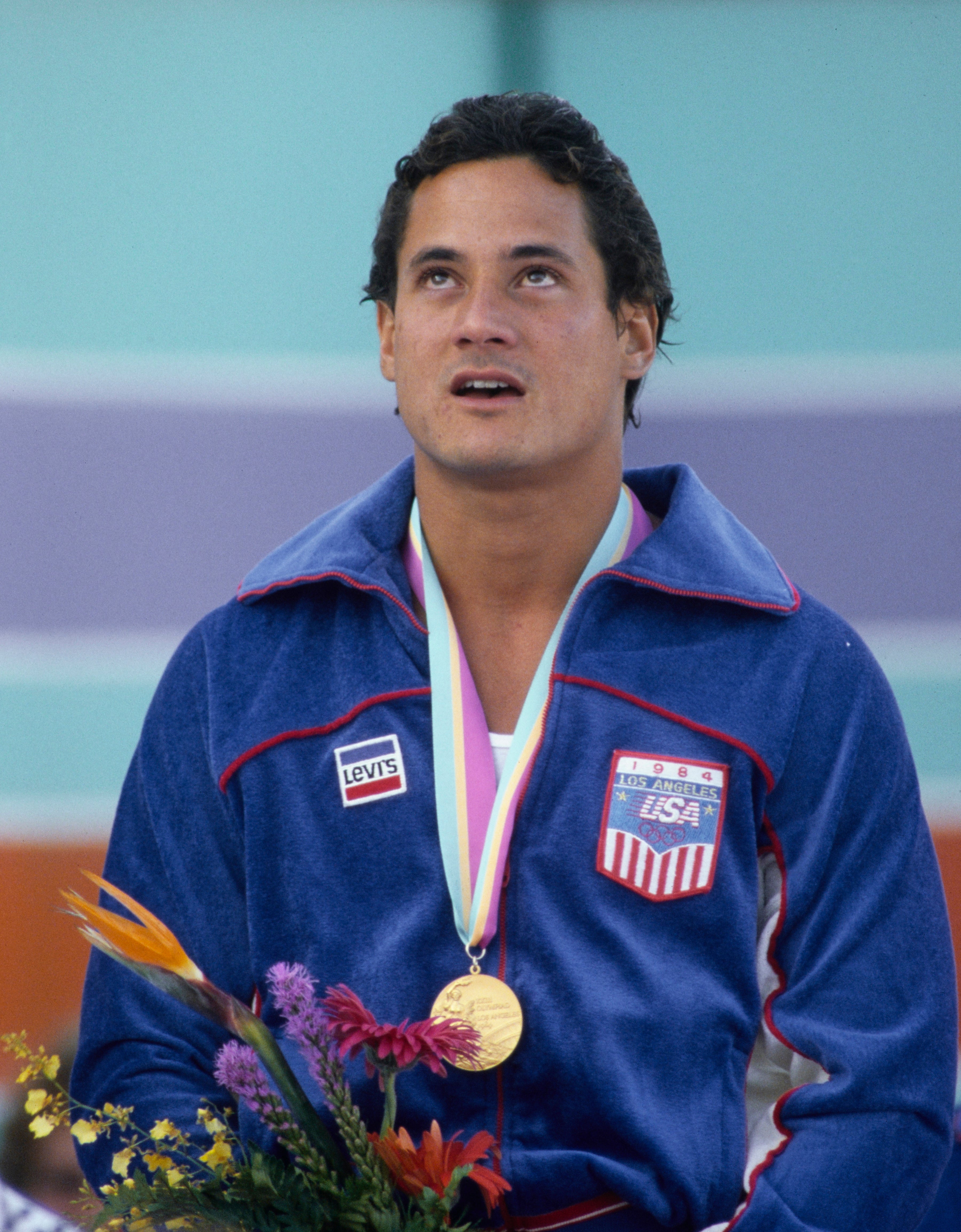 Greg Louganis wears his gold medal at the 1984 Olympic Games in Los Angeles, California. The medal sold in July for $199,301