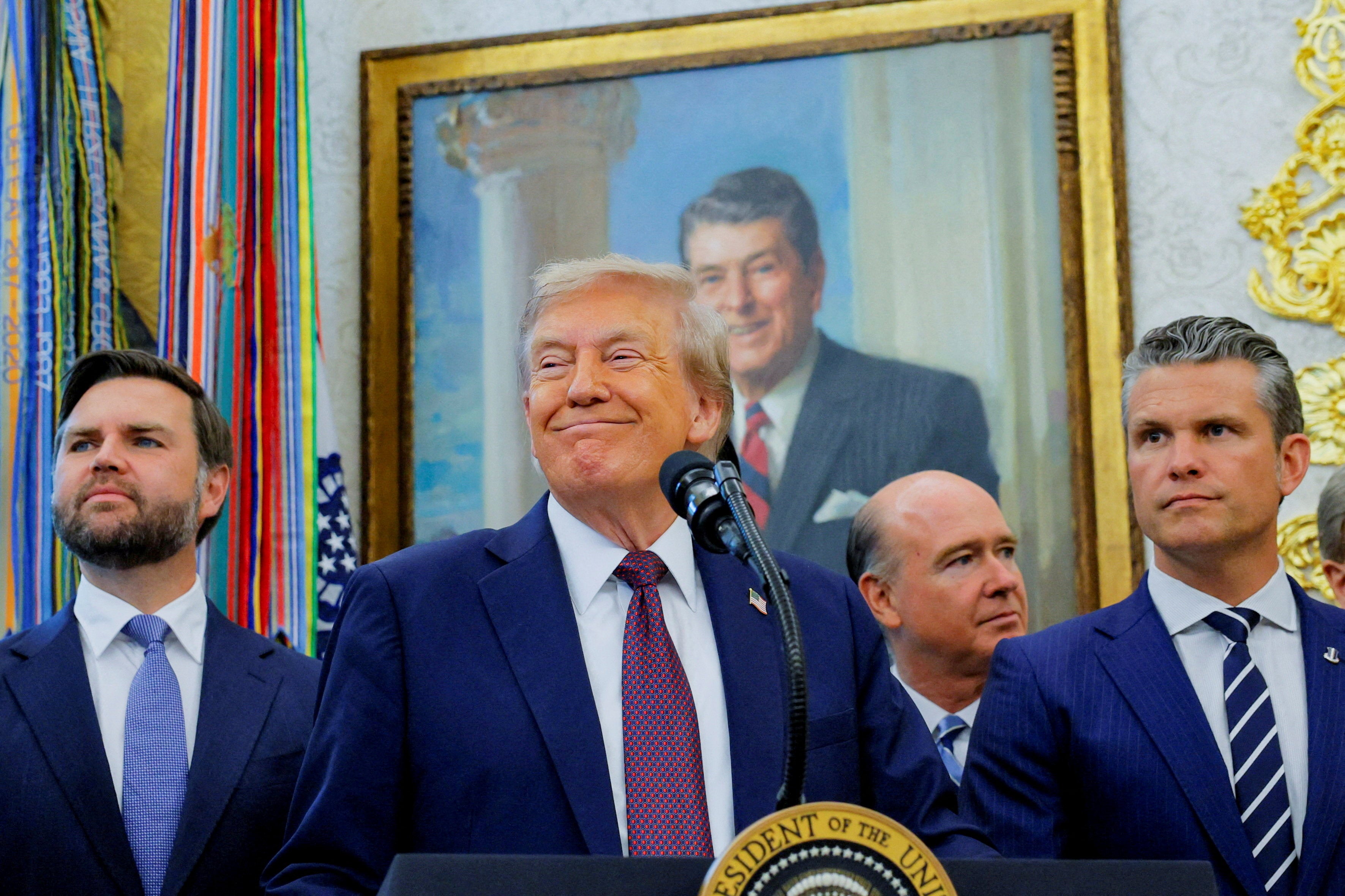 Donald Trump, next to Vice President JD Vance and Secretary of Defense Pete Hegseth, attends an event to announce that the Space Force Command will move from Colorado to Alabama
