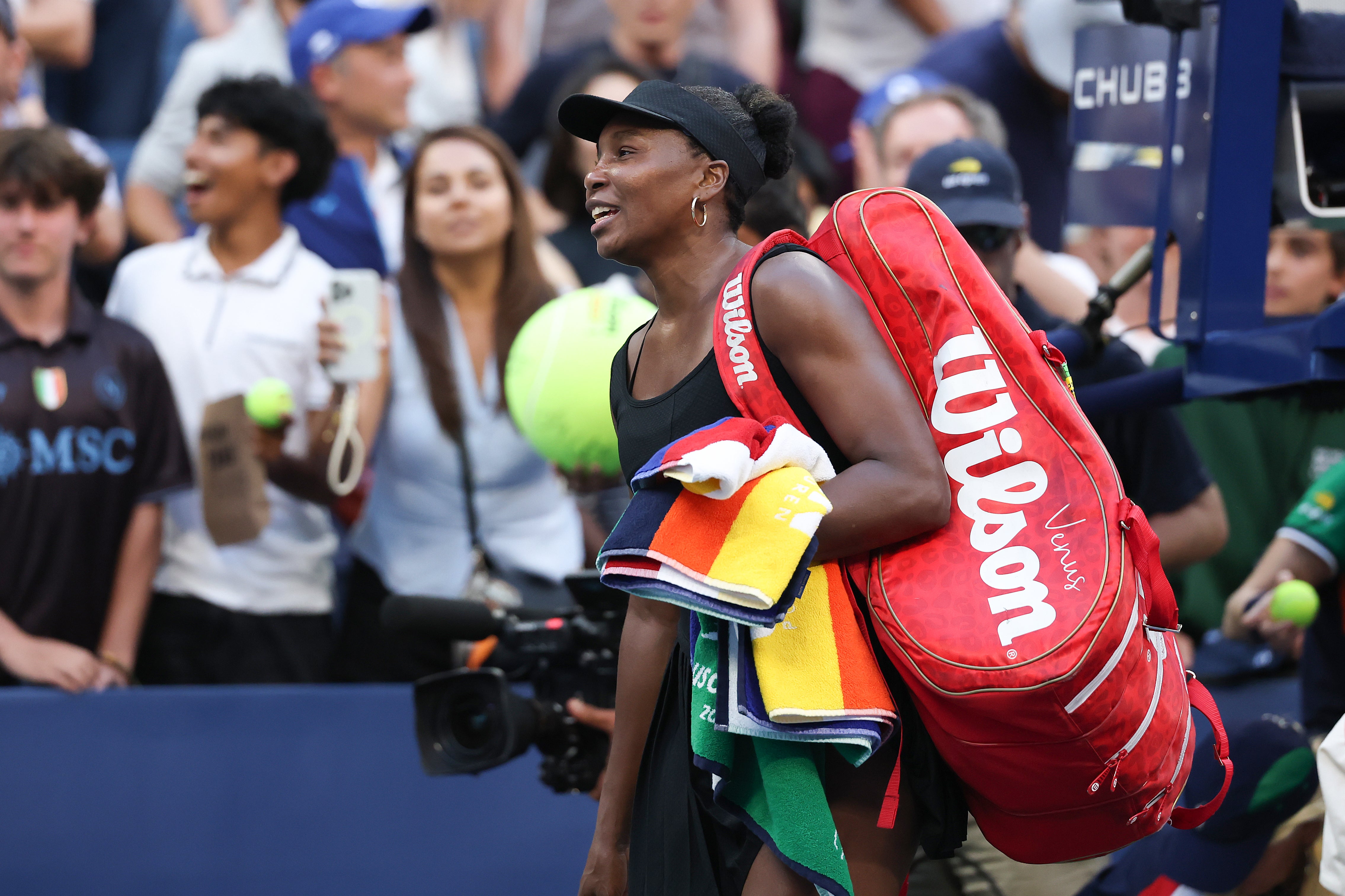 Venus Williams exits the court after defeat with Leylah Fernandez in the doubles