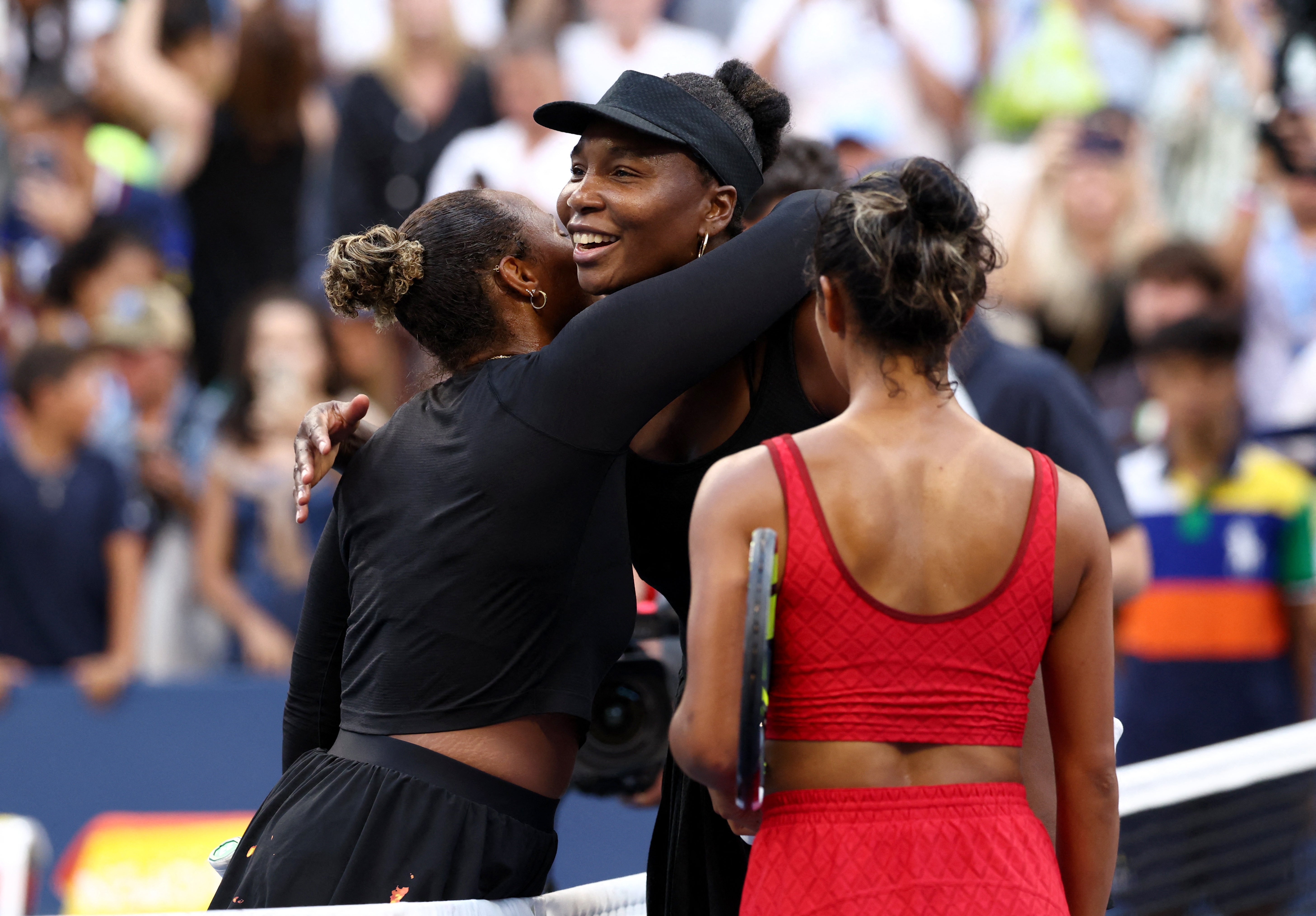 Williams hugs Taylor Townsend after defeat in the doubles