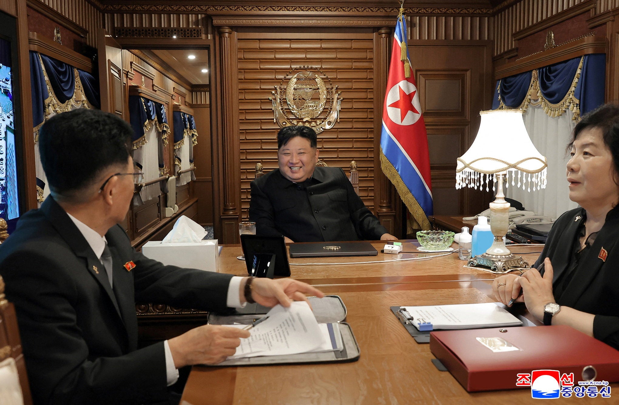 North Korean leader Kim Jong Un travels by train as he leaves Pyongyang to attend China's celebration of the formal surrender of Japan in World War Two, in this picture released by the Korean Central News Agency