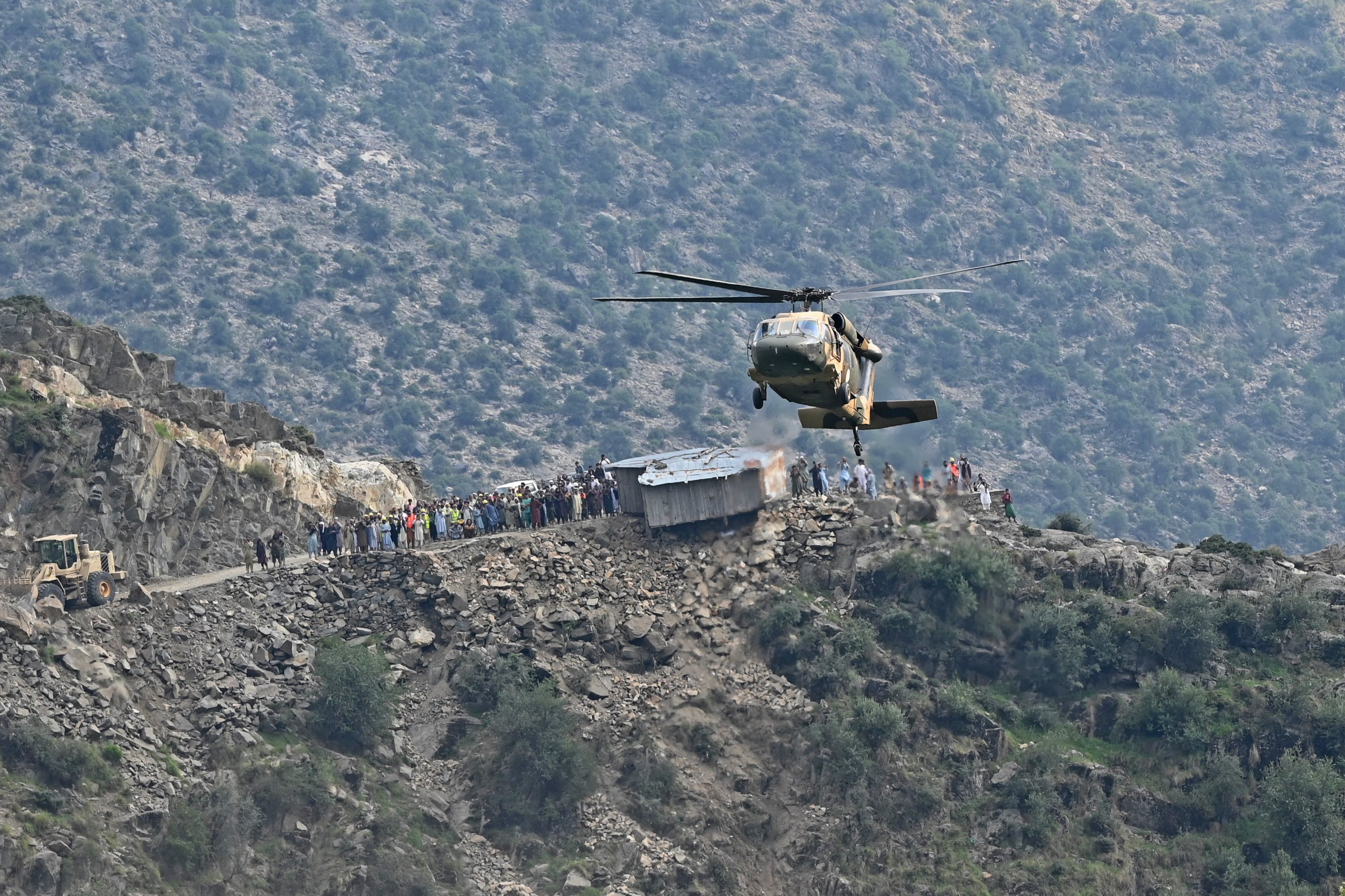 A military helicopter airlifts injured Afghans at Mazar Dara village in Nurgal district of Kunar province on 1 September 2025