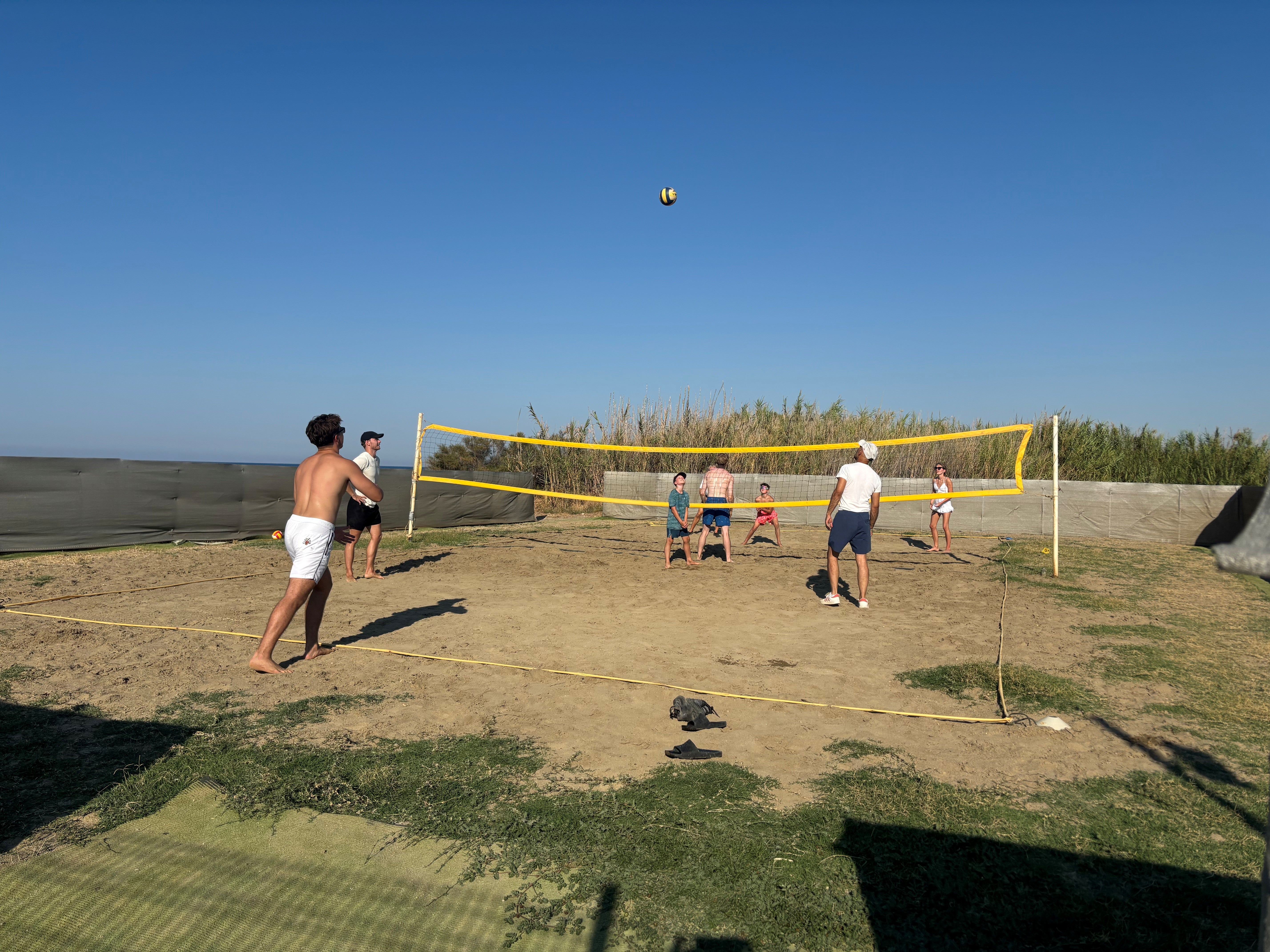 Guests enjoy a game of beach volleyball