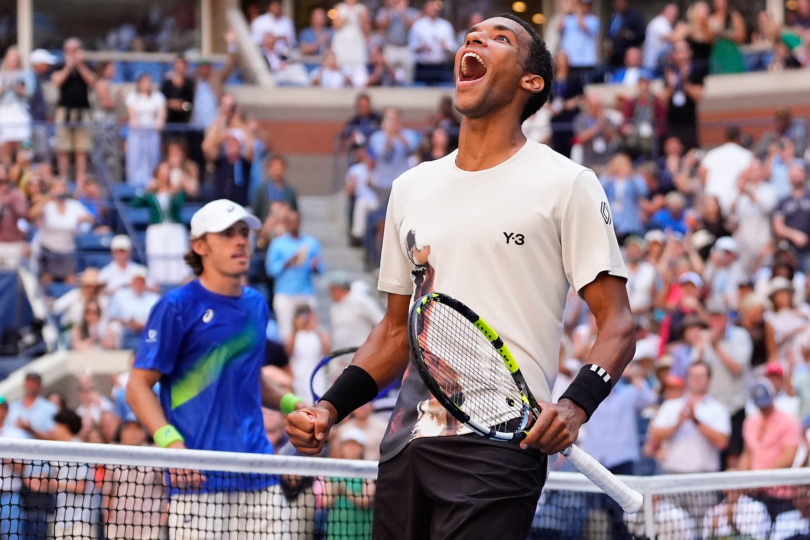 Felix Auger-Aliassime celebrates beating Alex De Minaur (Yuki Iwamura/AP)