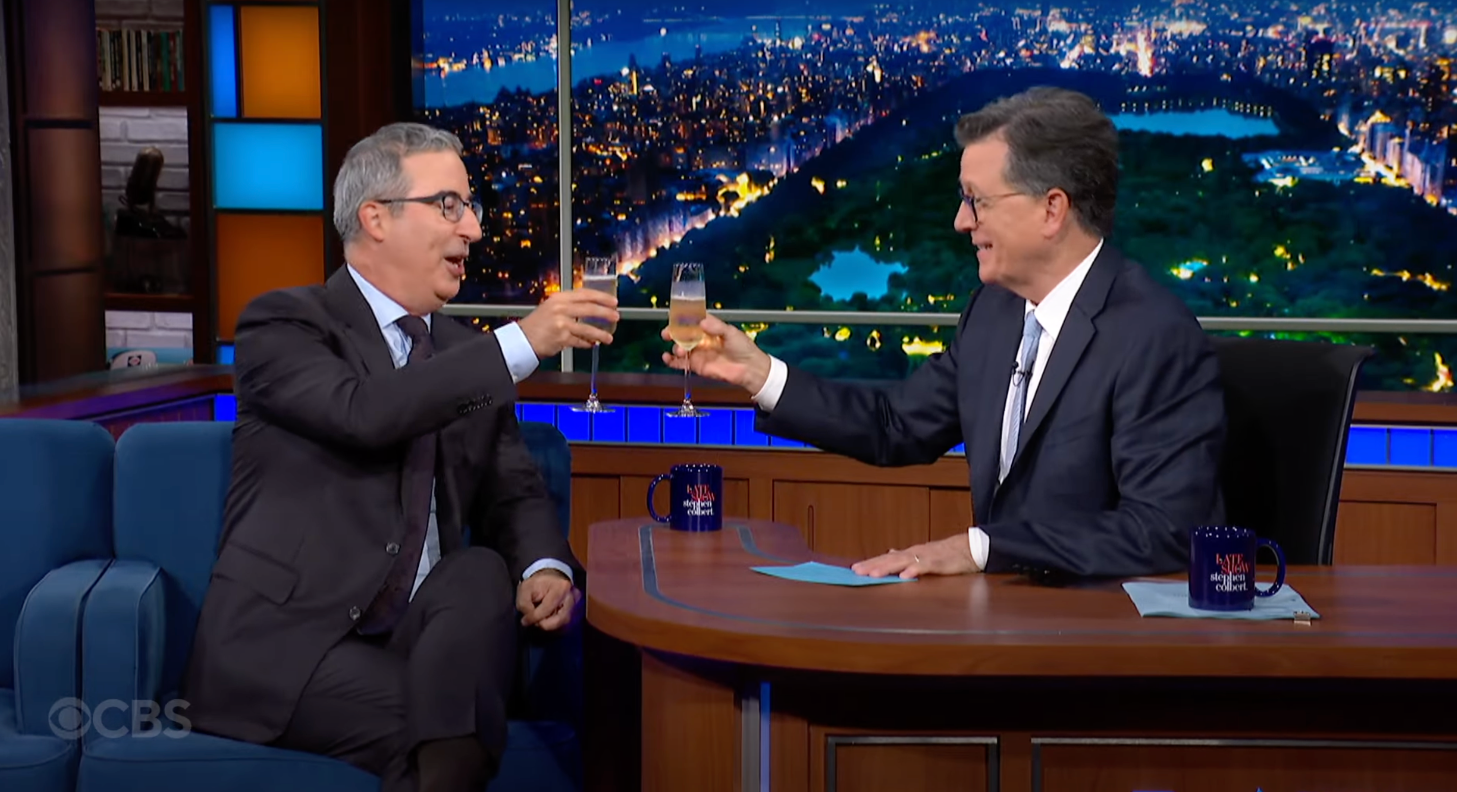 John Oliver and Stephen Colbert raise a toast to late night shows