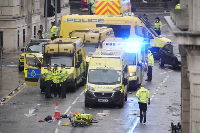 <p>Police and emergency personnel on Water Street, Liverpool, following the crash after the victory parade (Danny Lawson/PA)</p>