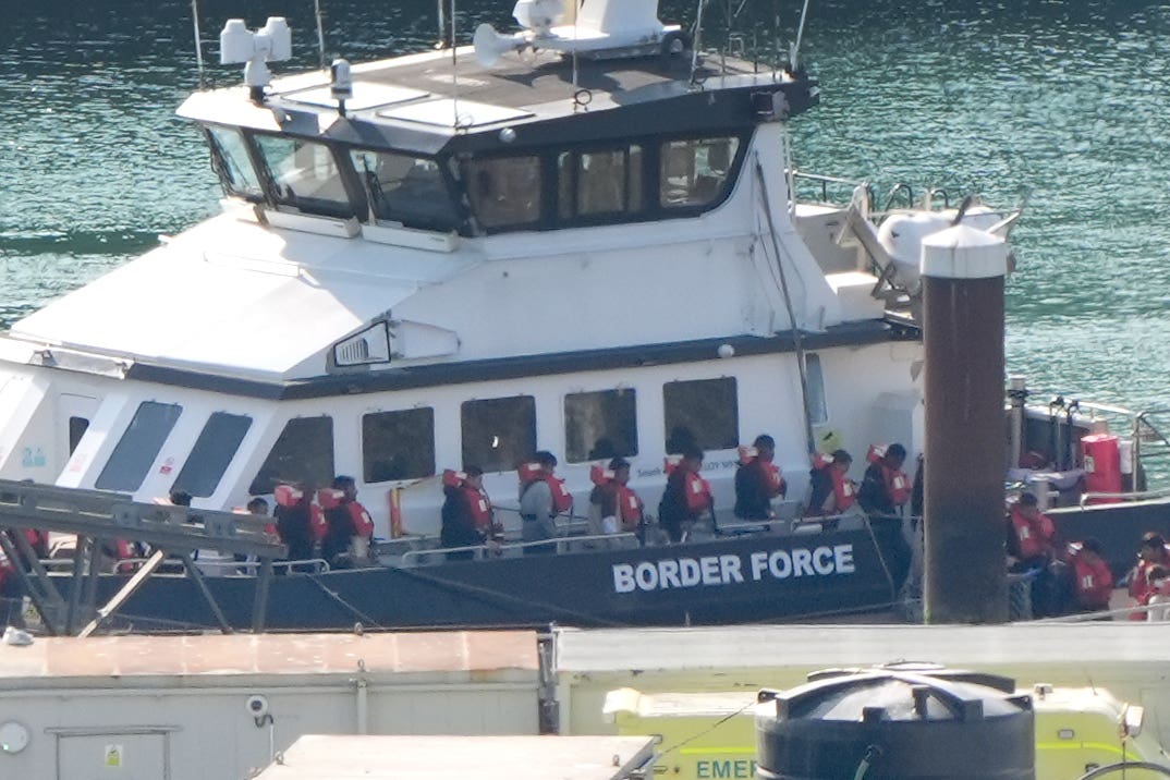 A group of people thought to be migrants are brought ashore in August in Dover from a Border Force vessel (Gareth Fuller/PA)