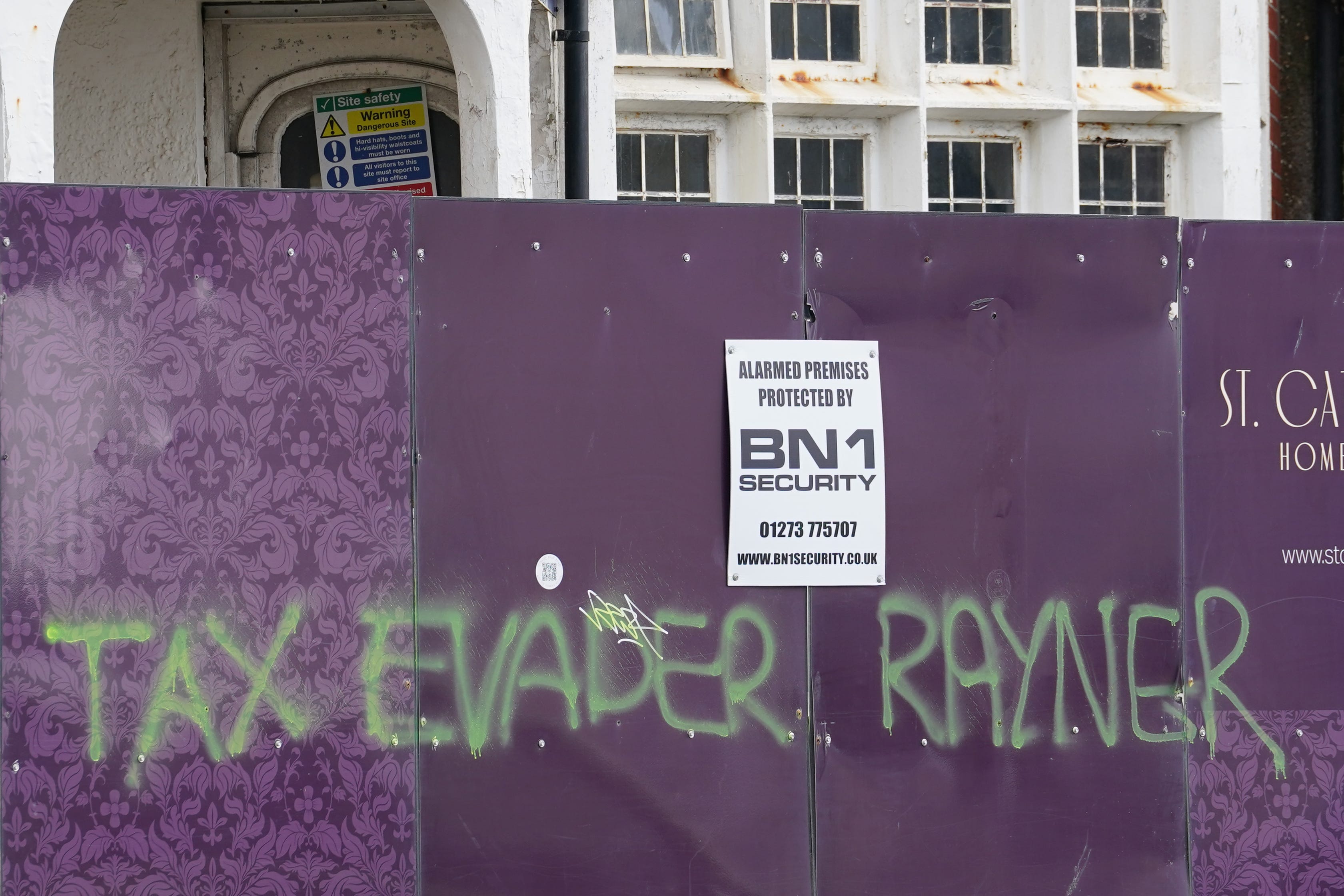 Graffiti daubed close to the apartment building in Hove, East Sussex, where Deputy Prime Minister Angela Rayner owns a second home (Gareth Fuller/PA)