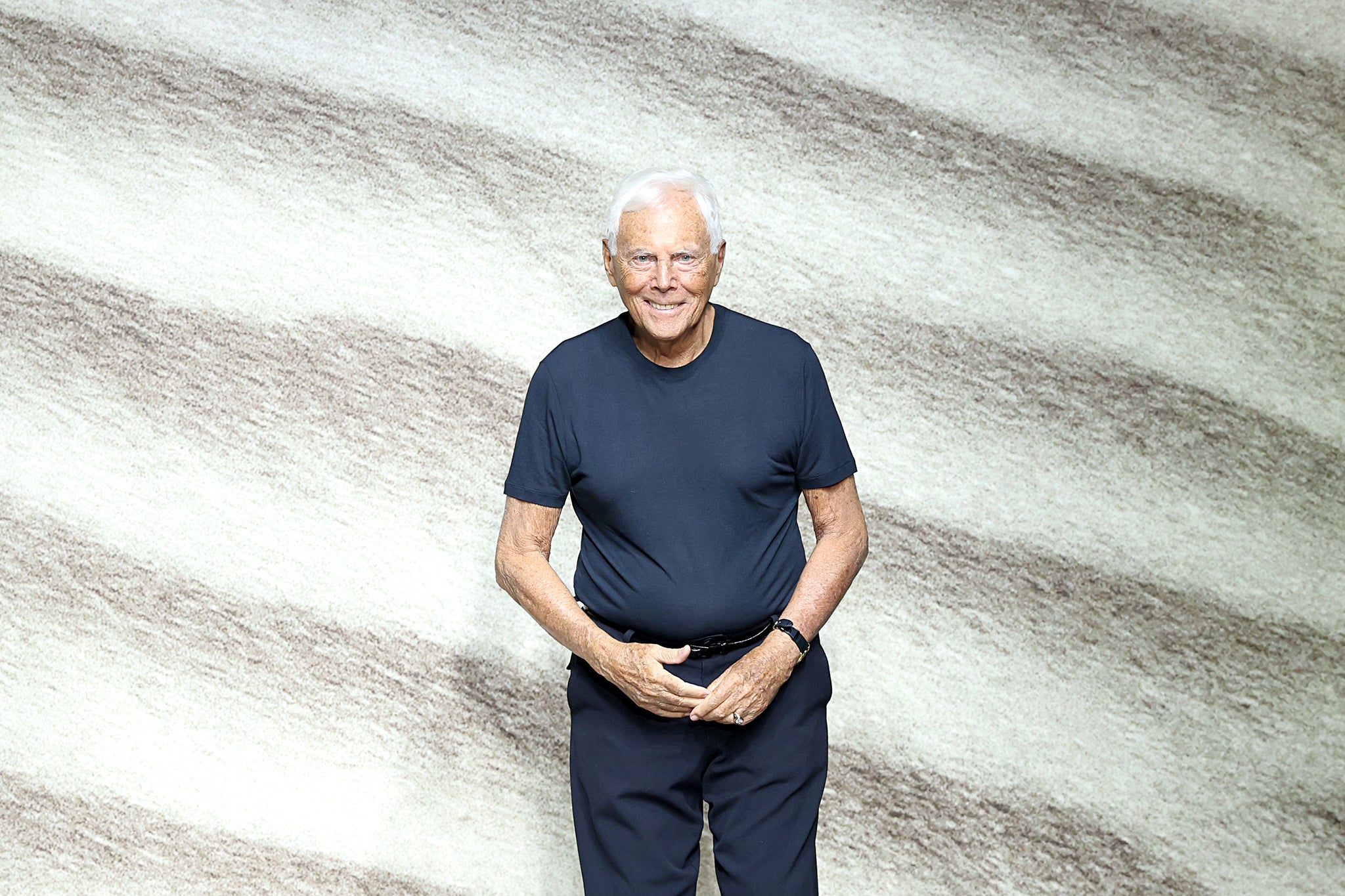 Armani acknowledges the applause of the audience at the Giorgio Armani fashion show during the Milan Fashion Week S/S 2023 on June 20, 2022