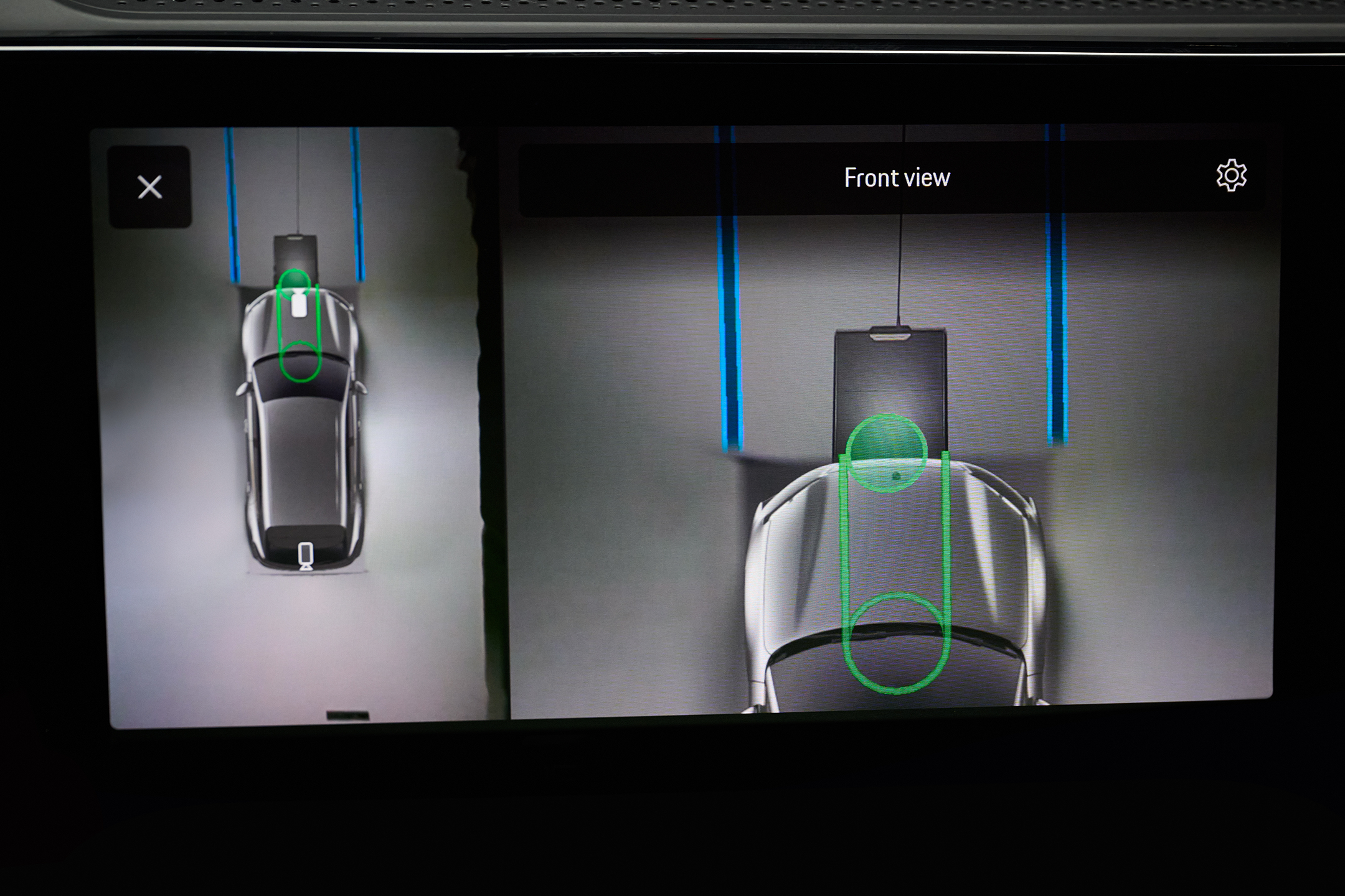 Porsche’s parking camera helps you align the car’s charging plate with the floor pad