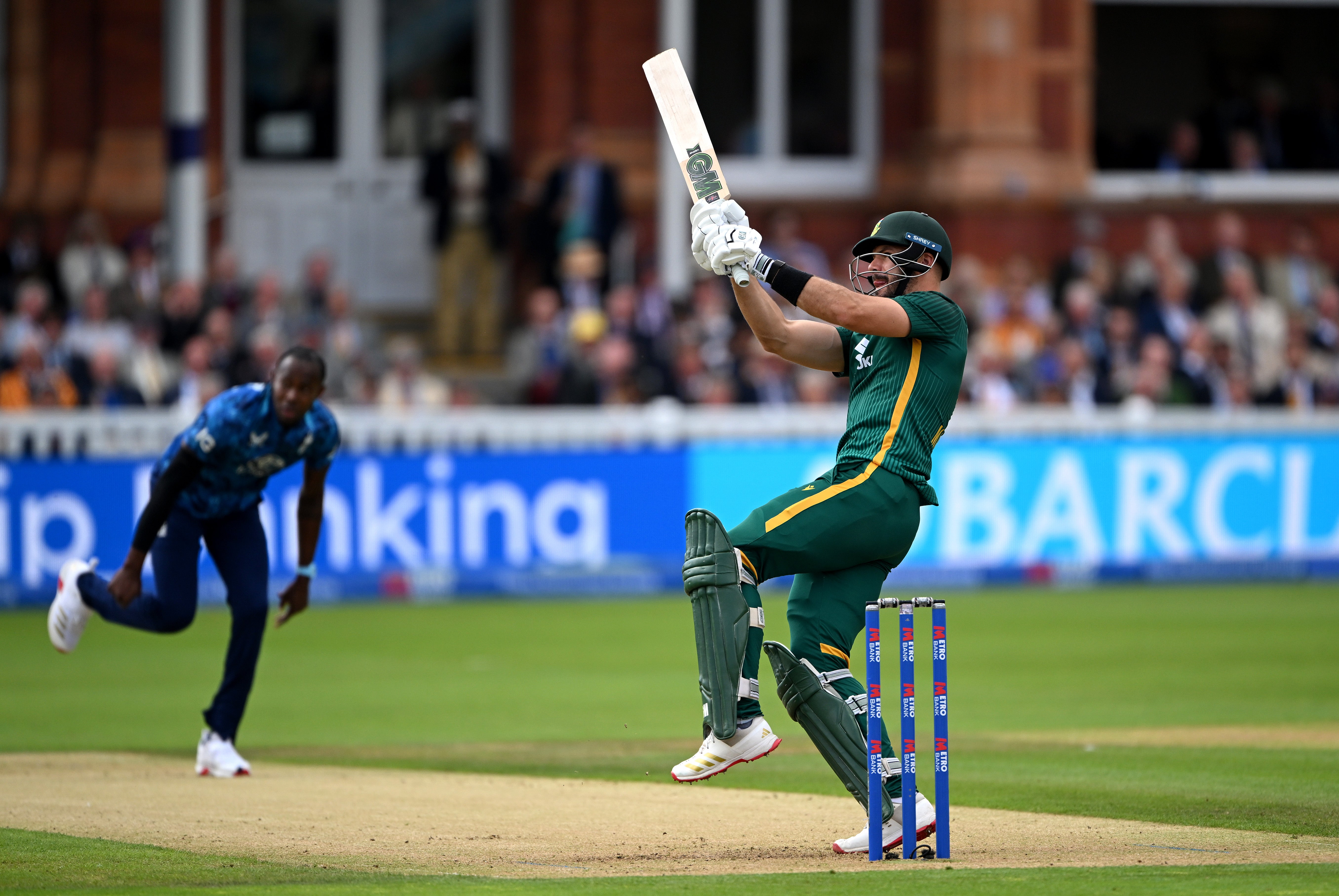 Aiden Markram of South Africa hits a six off the bowling of Jofra Archer