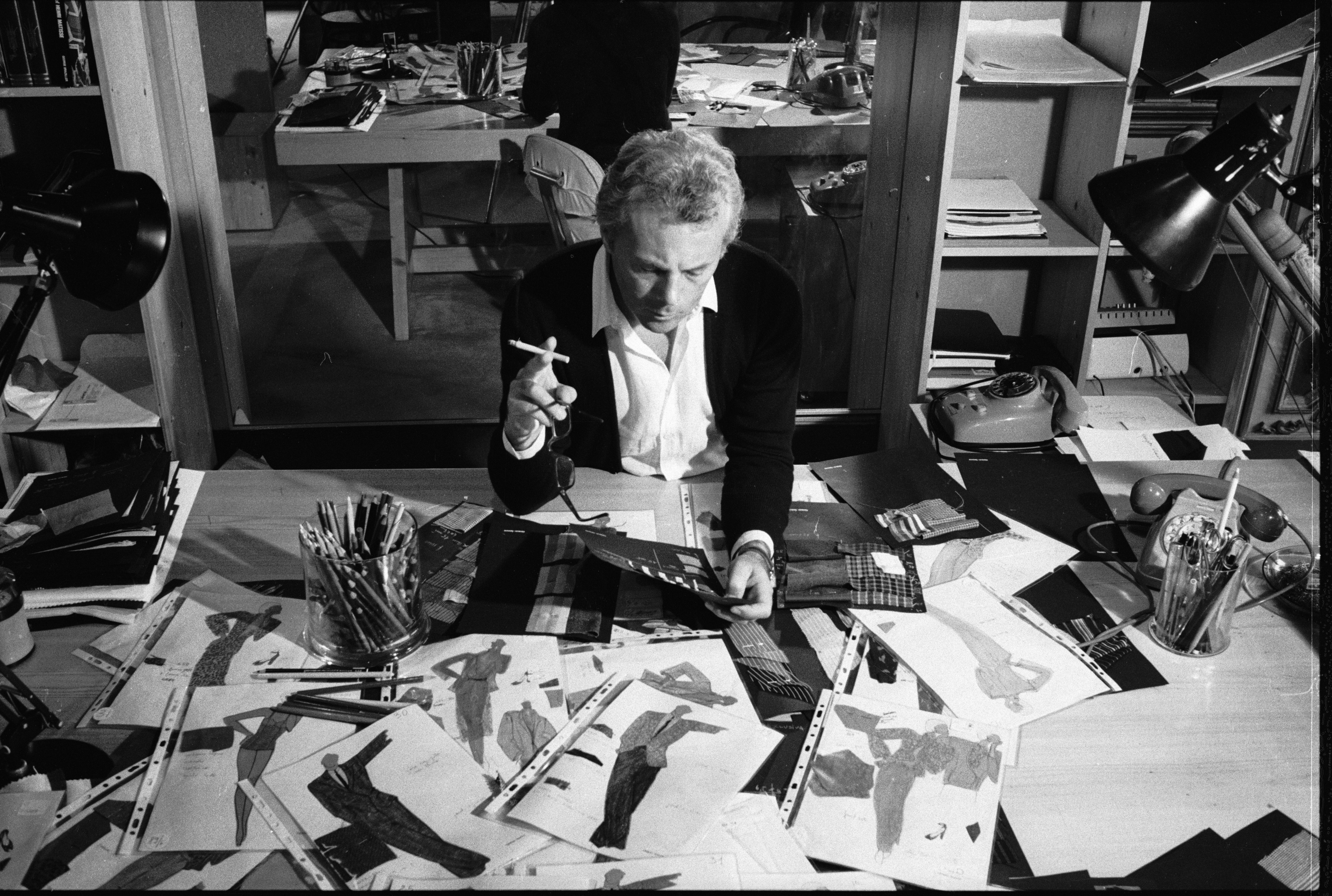 Smoking hot: Giorgio Armani in his atelier studying his iconic designs