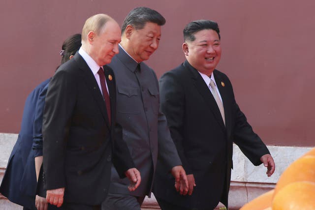 <p>Vladimir Putin, Xi Jinping and Kim Jong Un photographed together in September at an event to commemorate the end of the Second World War</p>