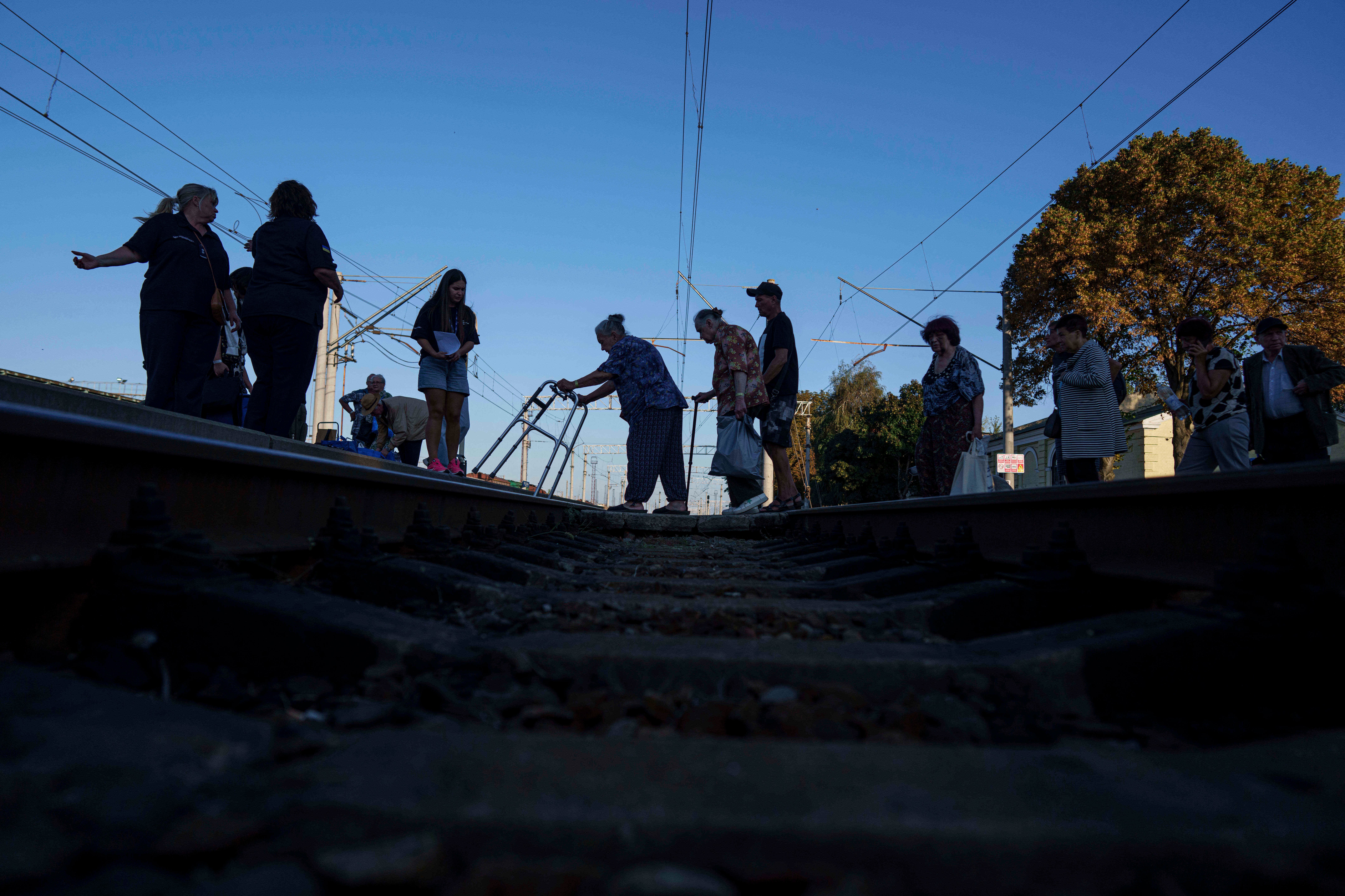 Despite the escalating danger, some residents remain in their shattered cities, clinging to the fragile hope that the conflict will soon conclude