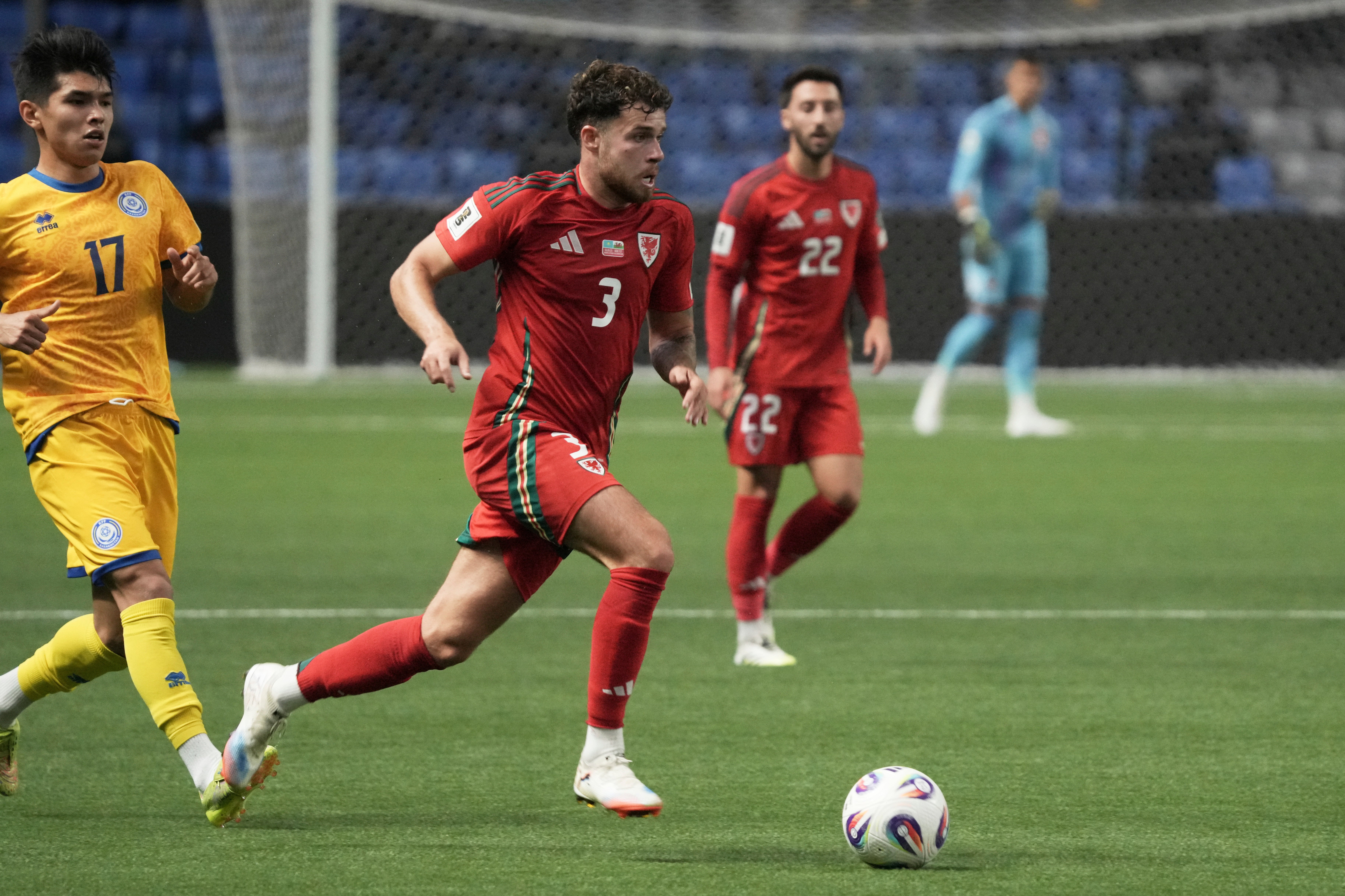 Neco Williams (centre) was recalled for Wales’ qualifier (Turar Kazangapov/AP)