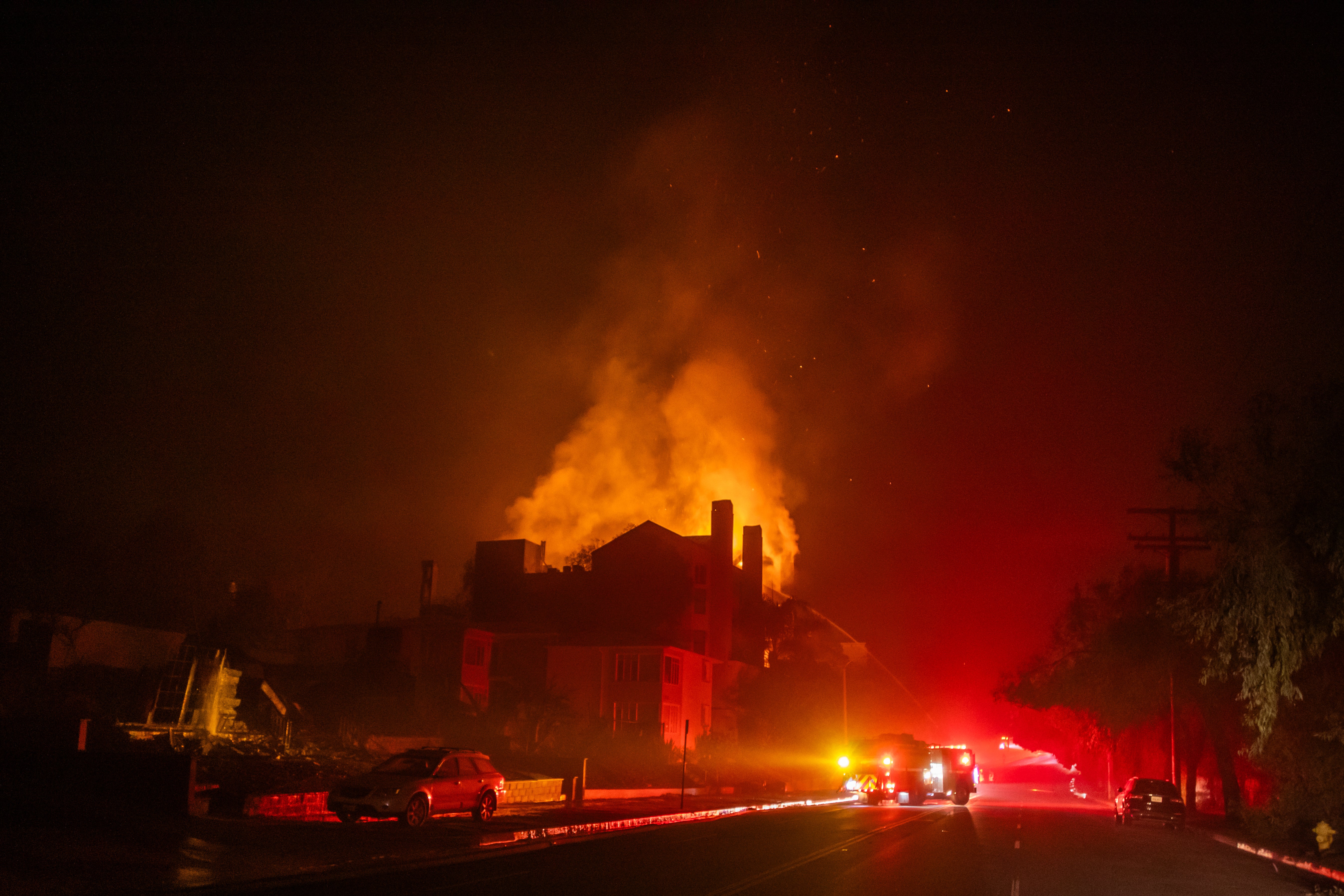The Palisades Fire raged in the Pacific Palisades neighborhood of Los Angeles, forcing many to flee the area as firefighters fought to contain the blaze