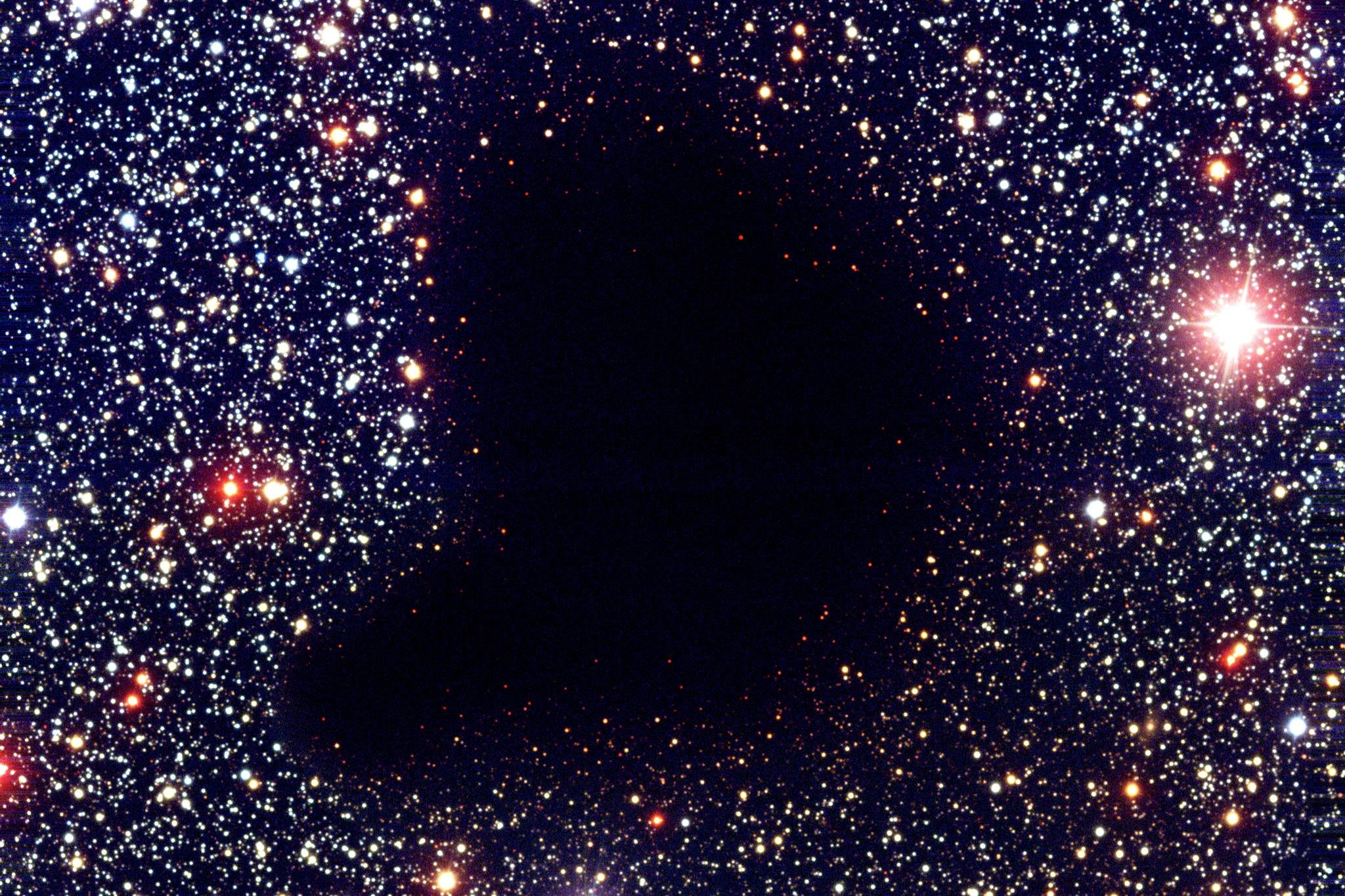 The dark interstellar cloud Barnard 68 resembles a 'hole in the heavens'