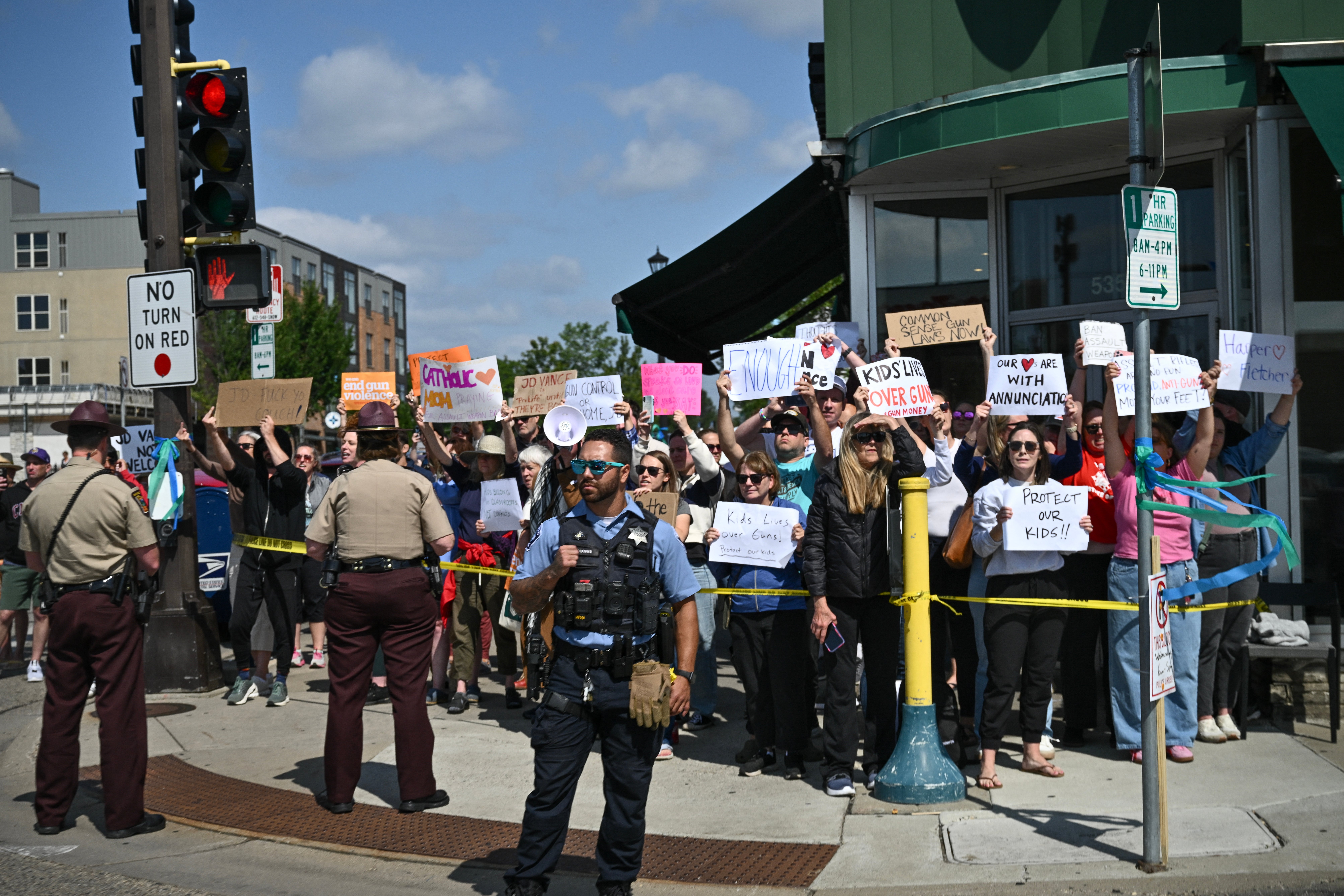 A large group of anti-gun advocates protested as the Vances arrived in Minneapolis on Wednesday