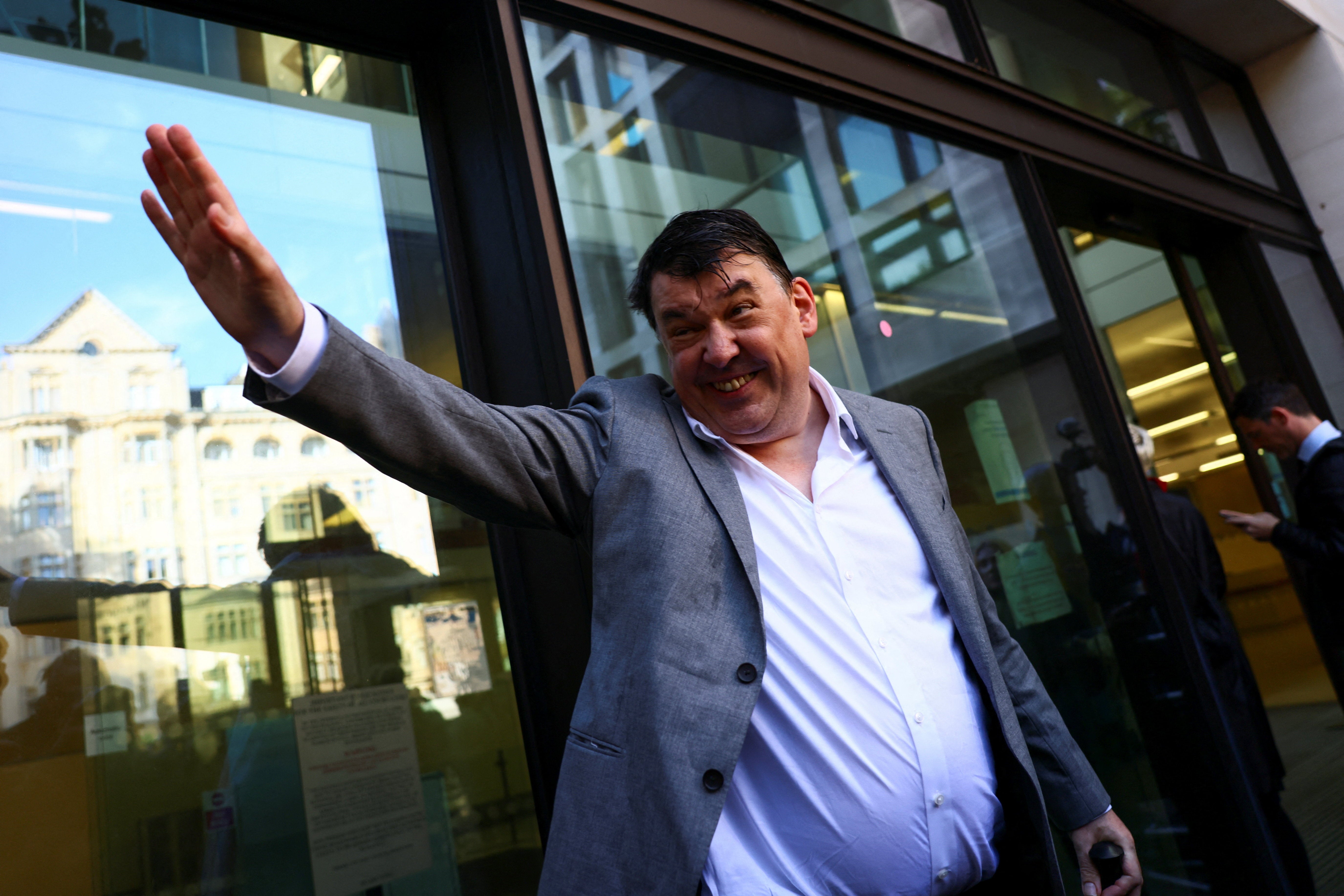 The comedian outside Westminster Magistrates’ Court for his trial over allegedly harassing a transgender activist