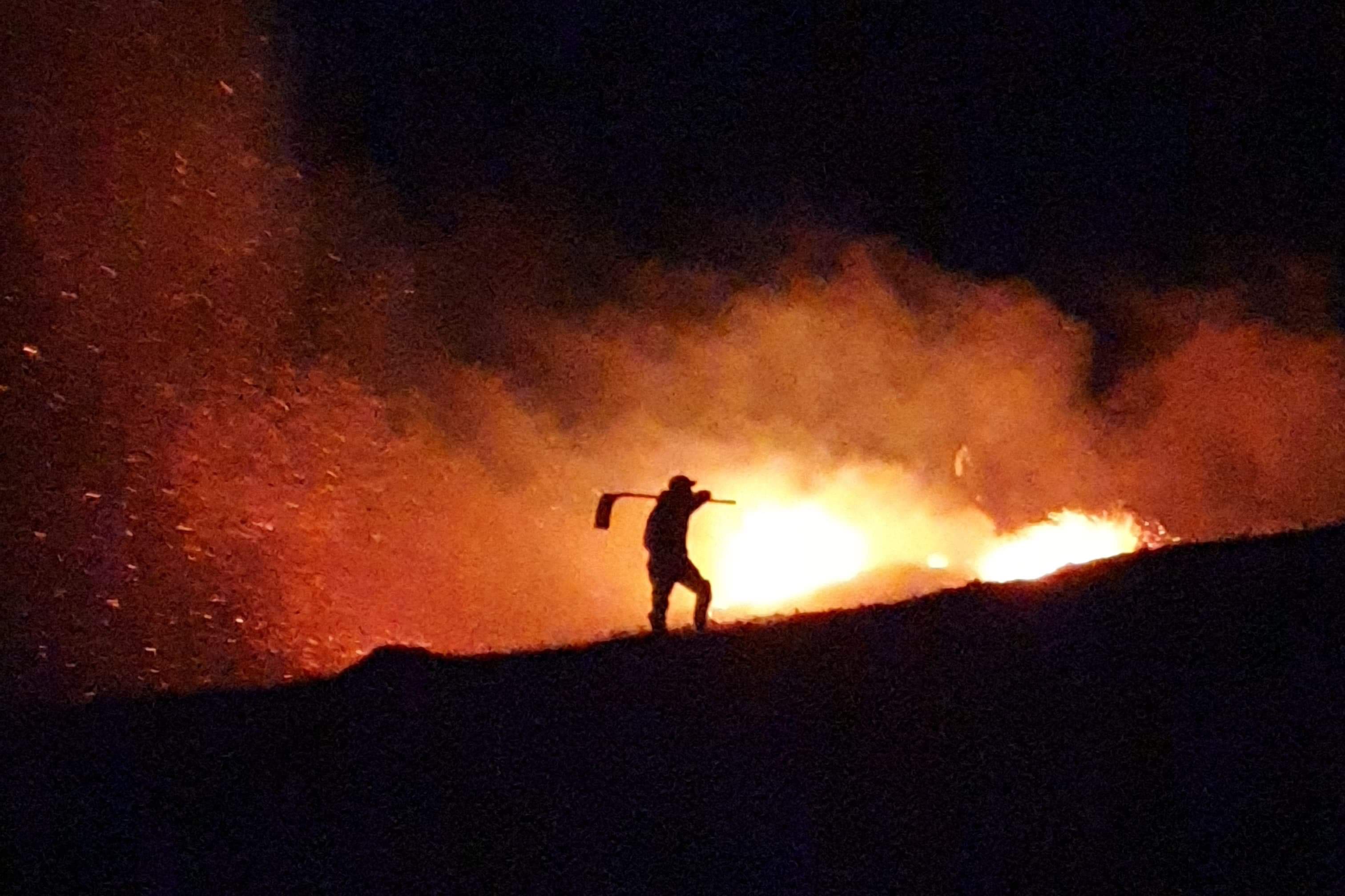 Gamekeeper tackling a wildfire (Scottish Gamekeepers Association/PA)