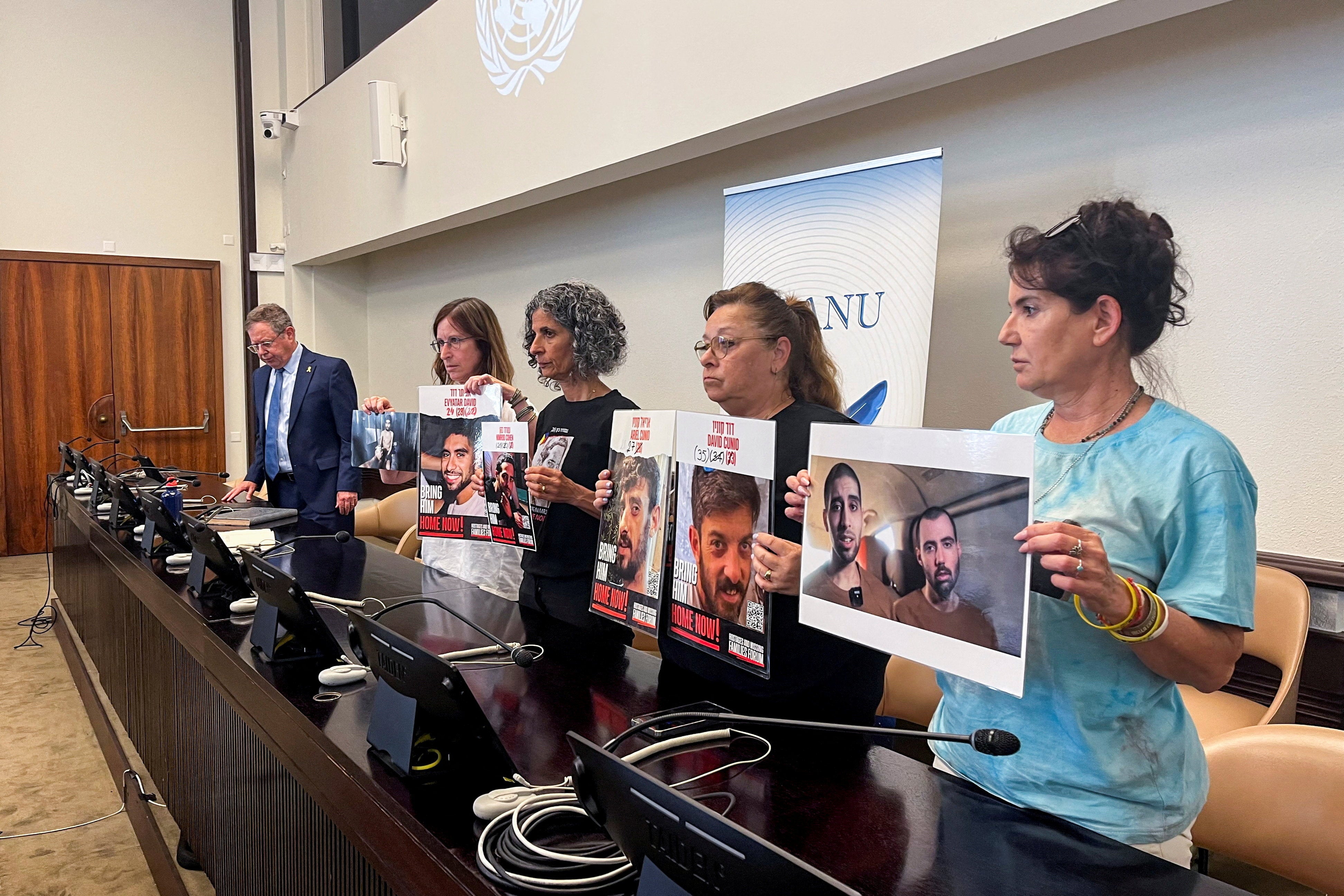 Galia David, mother of Evyatar David, Viki Cohen, mother of Nimrod Cohen, Silvia Cunio, mother of David and Ariel, and Merav Gilboa-Dalal, mother of Guy Gilboa-Dalal, hold pictures of their sons who are hostages in Gaza