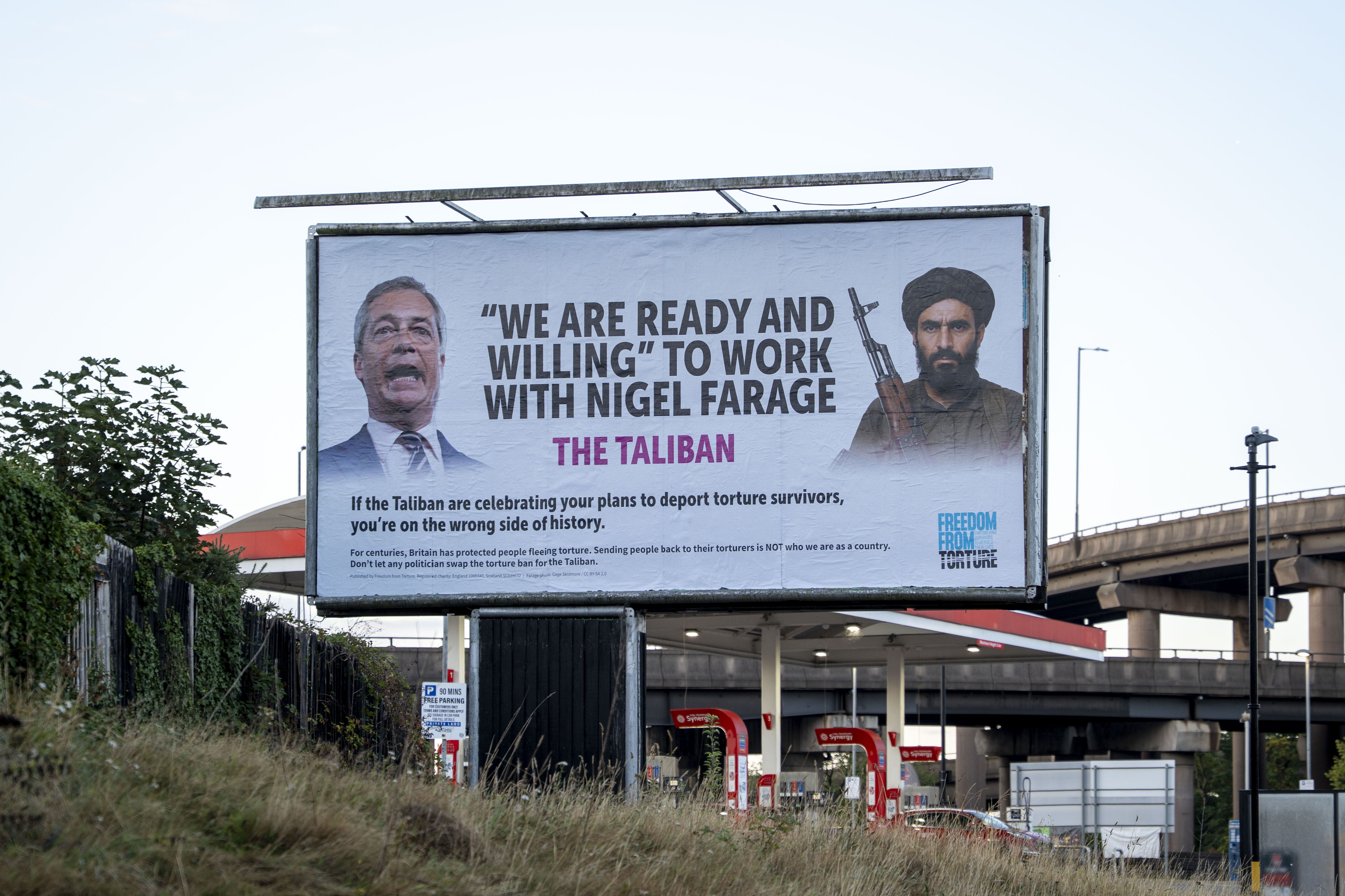 Billboard installed outside the Reform UK party convention in Birmingham on Friday (Rowan Farrell/Freedom from Torture/PA)