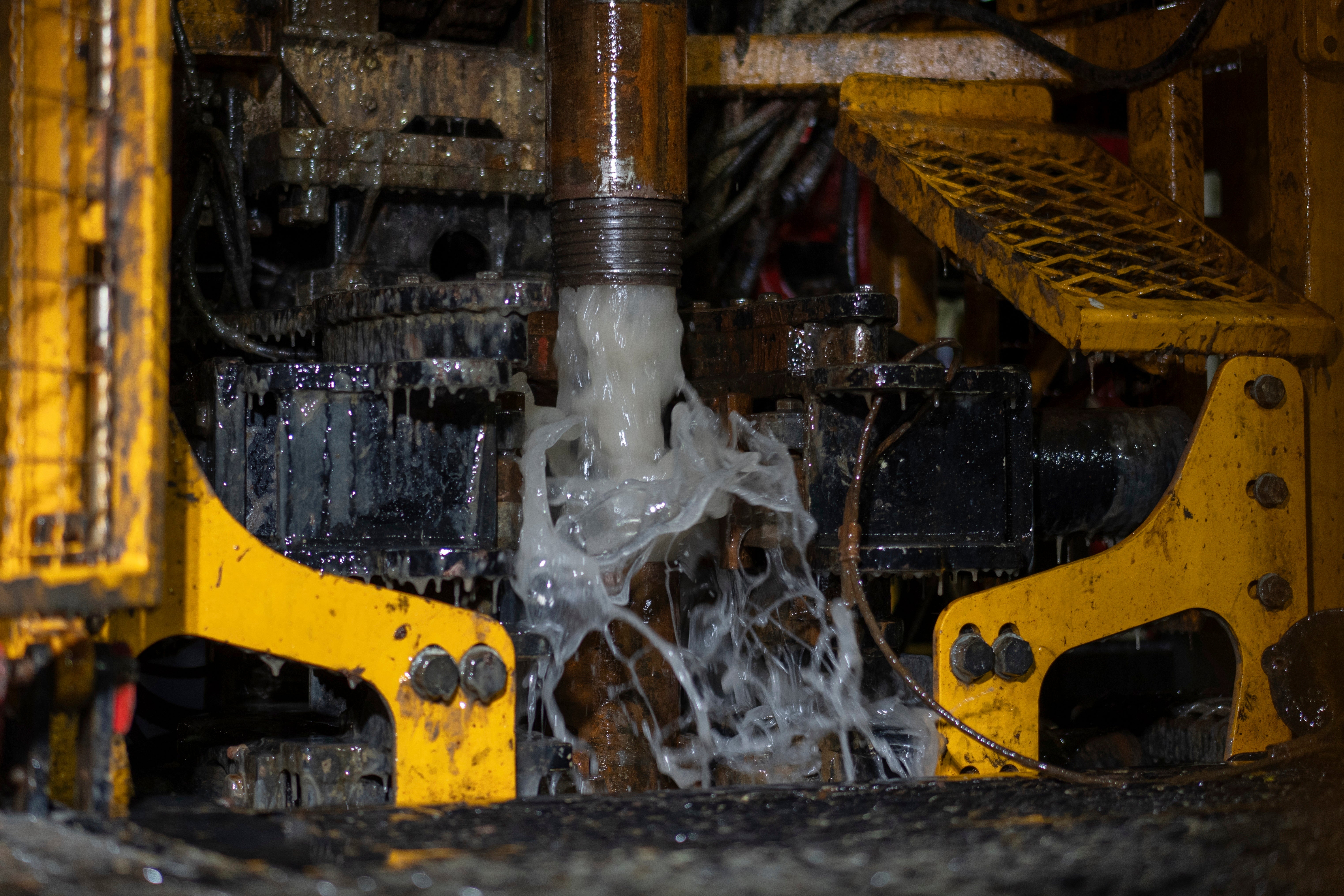 Residual water gushes from the Expedition 501 wireline core drilling rig during an operation aboard the Liftboat Robert platform, in the North Atlantic, Sunday, July 20, 2025. (AP Photo/Carolyn Kaster)