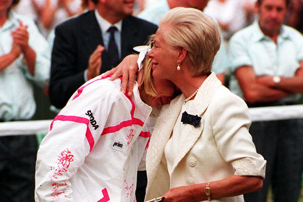 The duchess hugs Jana Novotna after she lost to defending champion Steffi Graf at Wimbledon in 1993