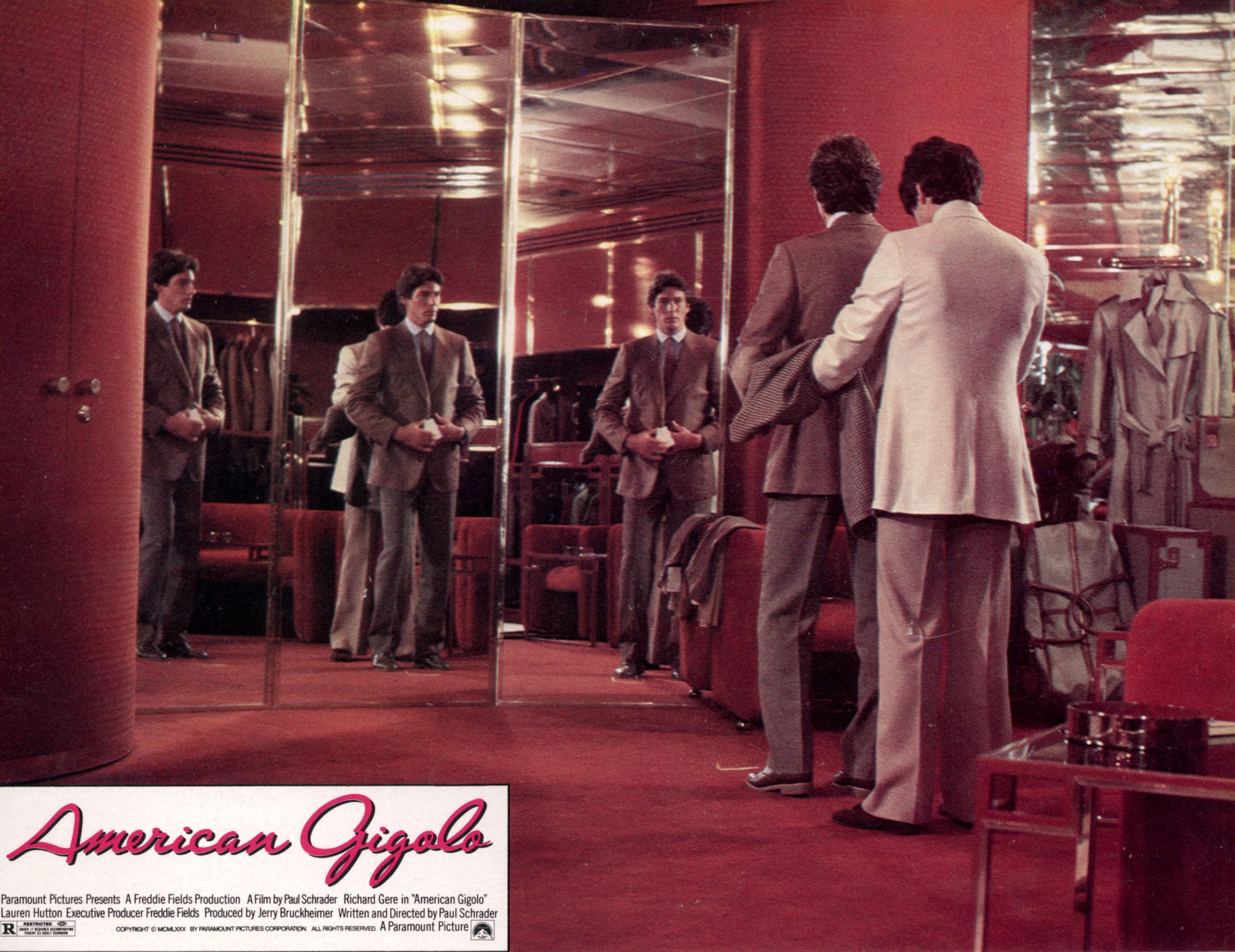 Gere being fitted for his Armani suit by his tailor in a poster showing the opening sequence of ‘American Gigolo’