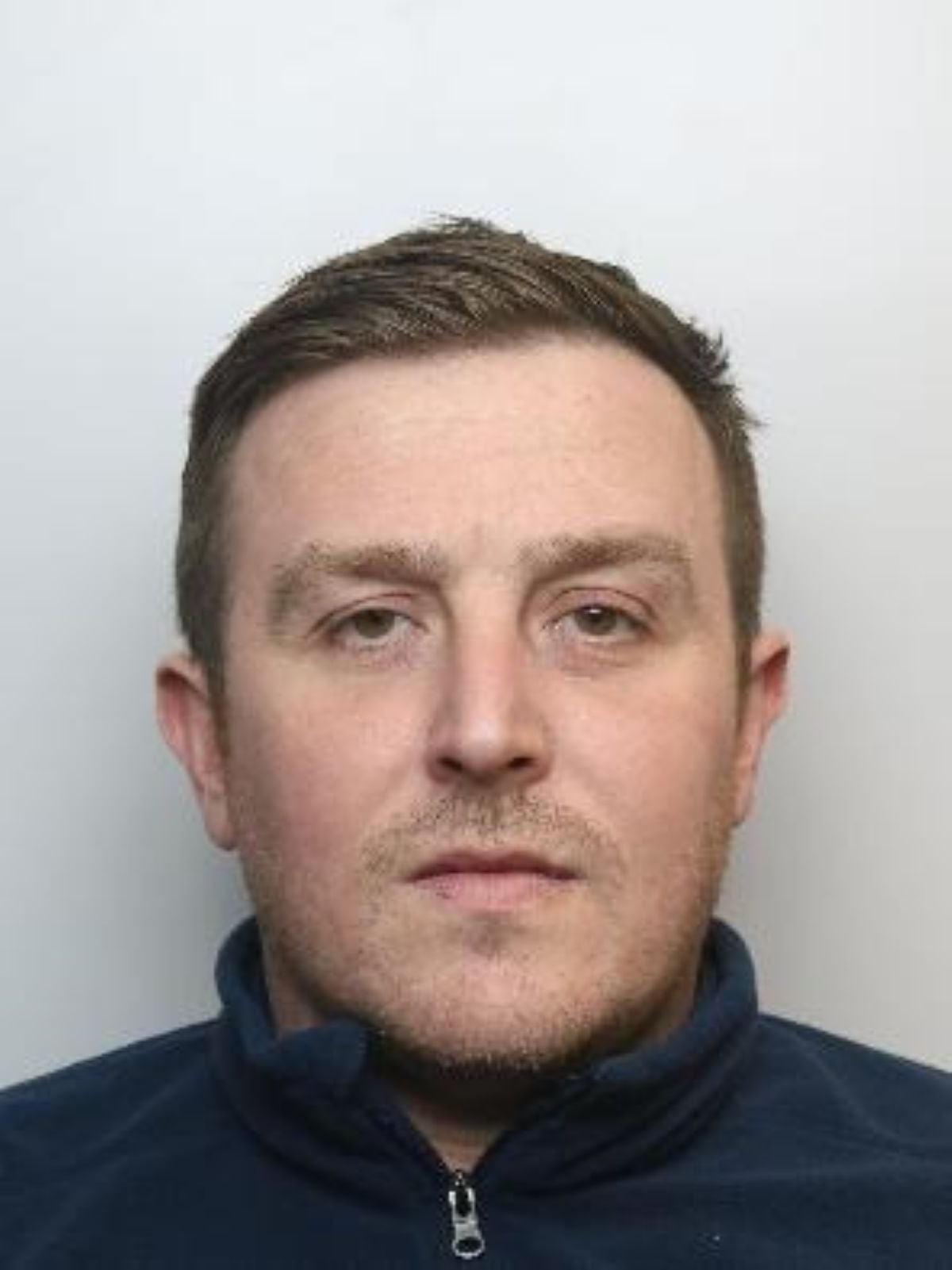 Crossland stoked a fire outside an asylum hotel