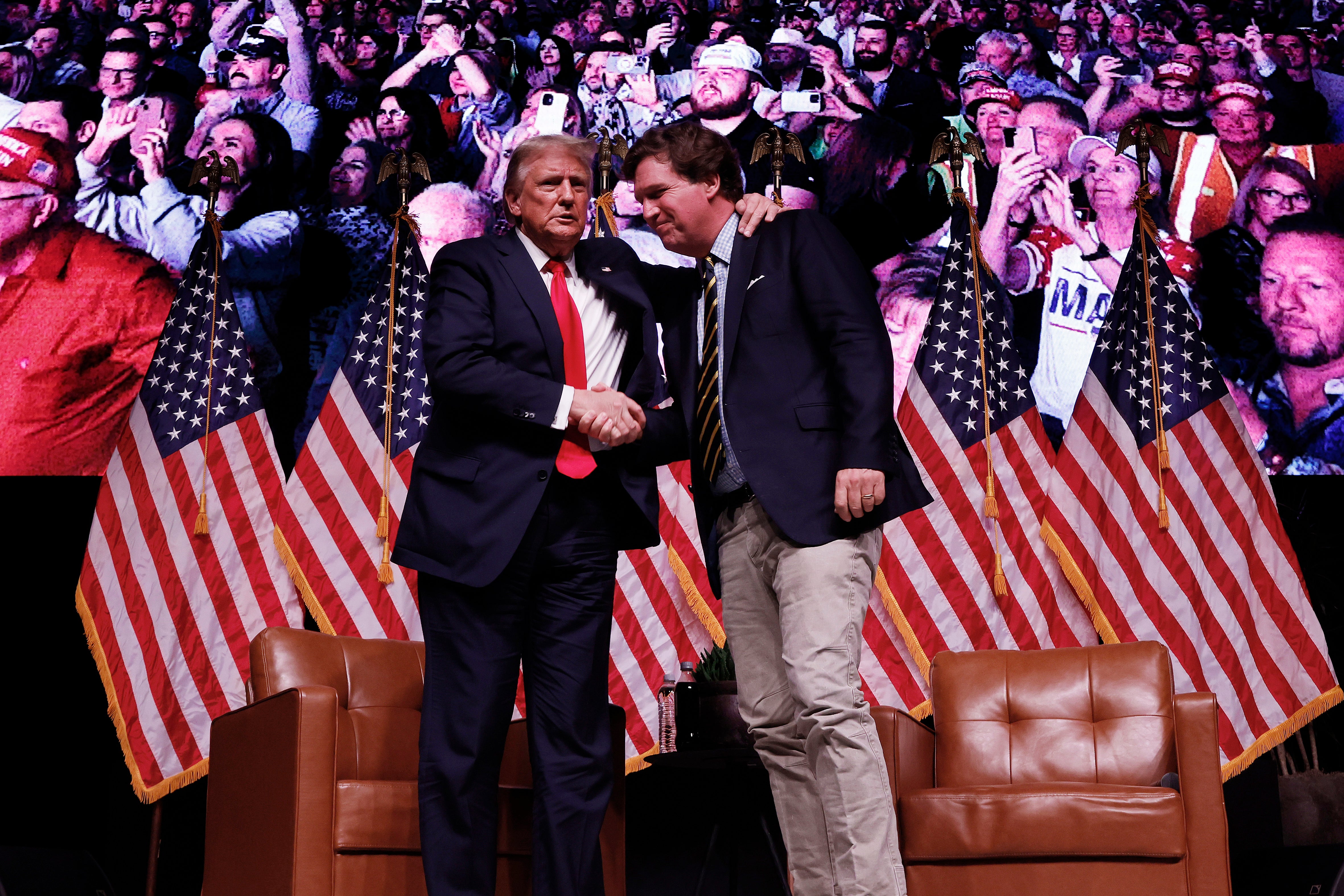 Donald Trump pictured with Tucker Carlson on the 2024 campaign trail