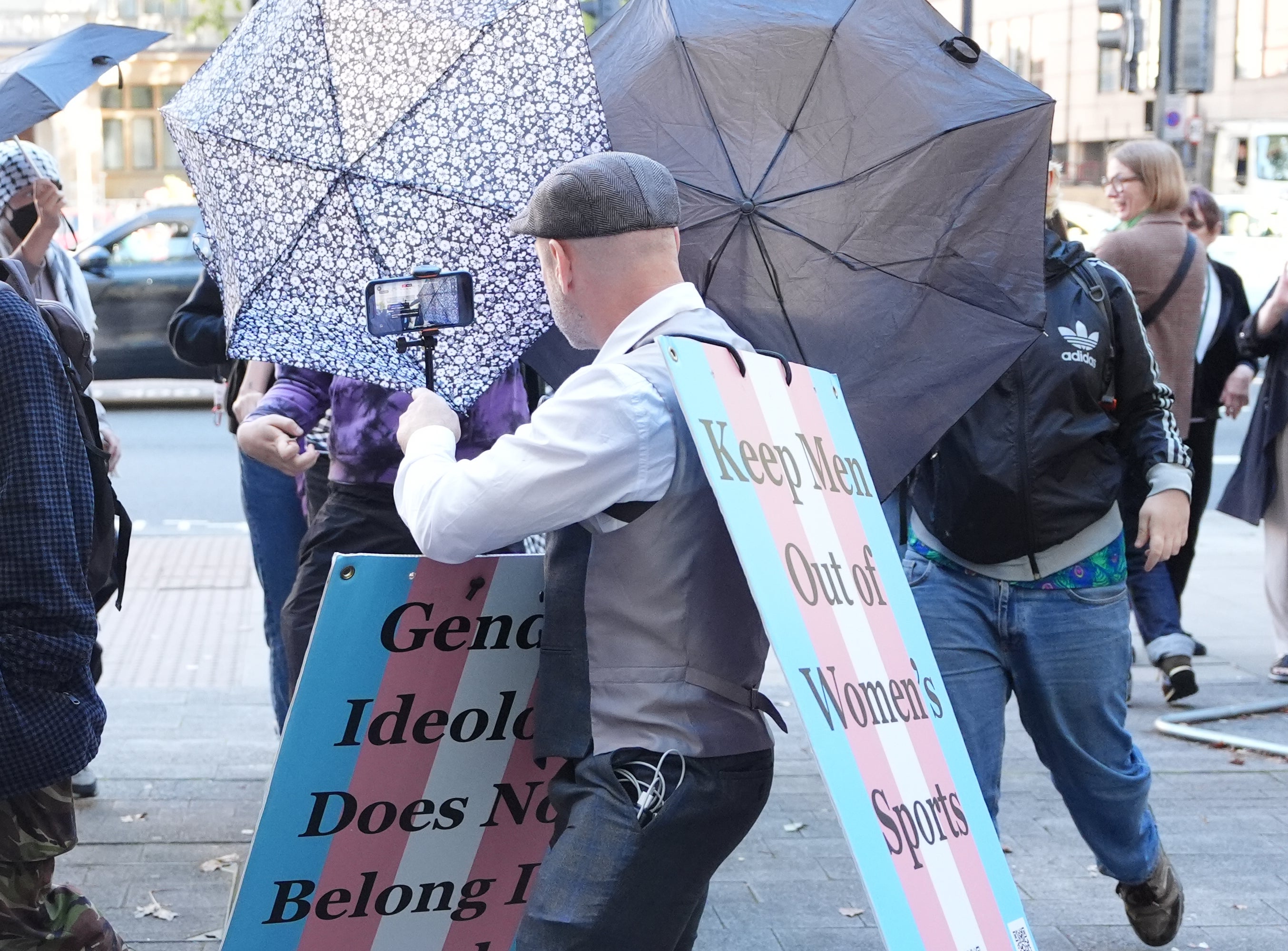 Supporters cover Sophia Brooks as she arrives at an earlier court appearance