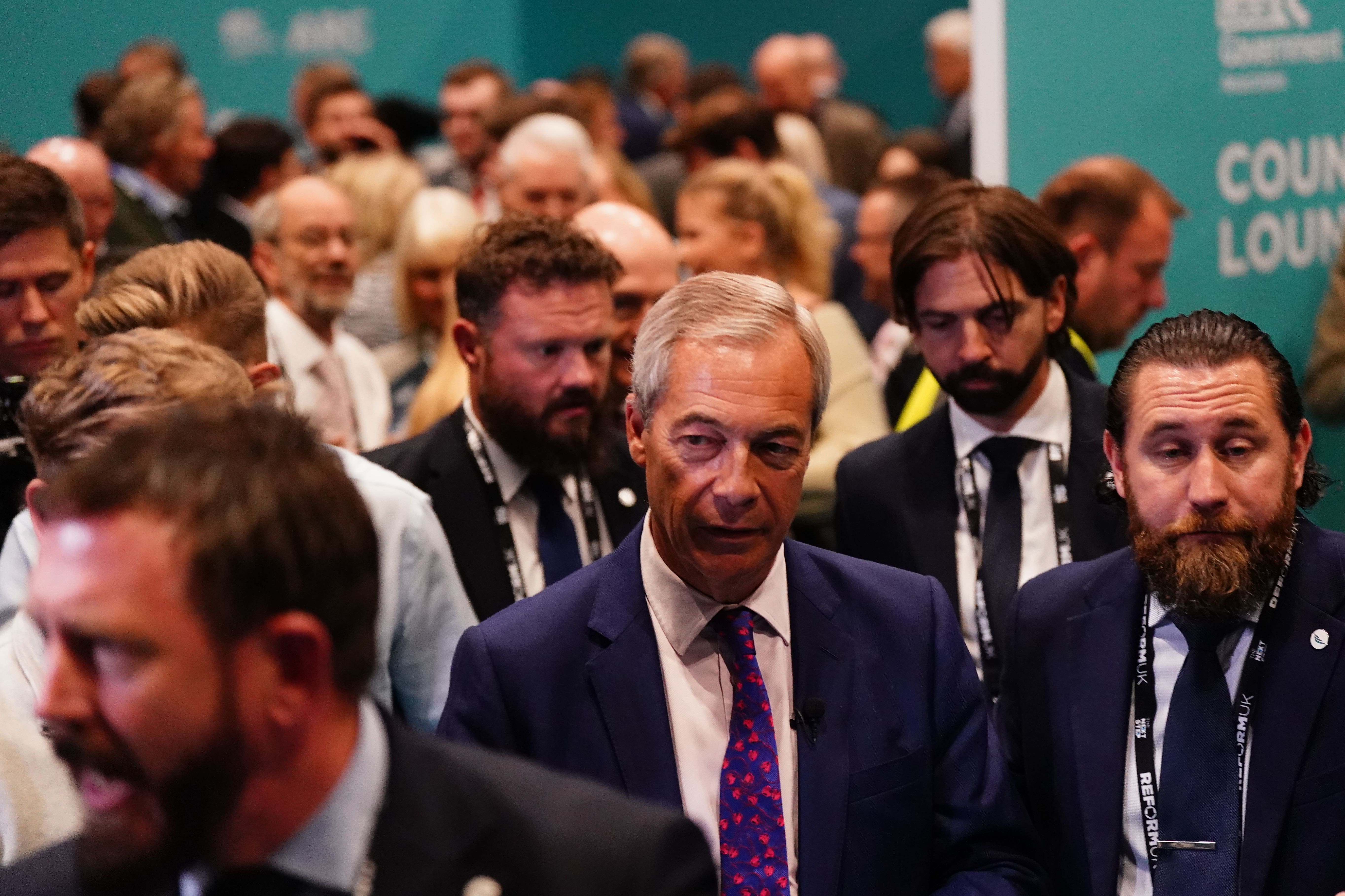 Reform UK leader Nigel Farage on a walkabout meeting delegates during the second day of the party’s annual conference in Birmingham on Saturday (Jacob King/PA)