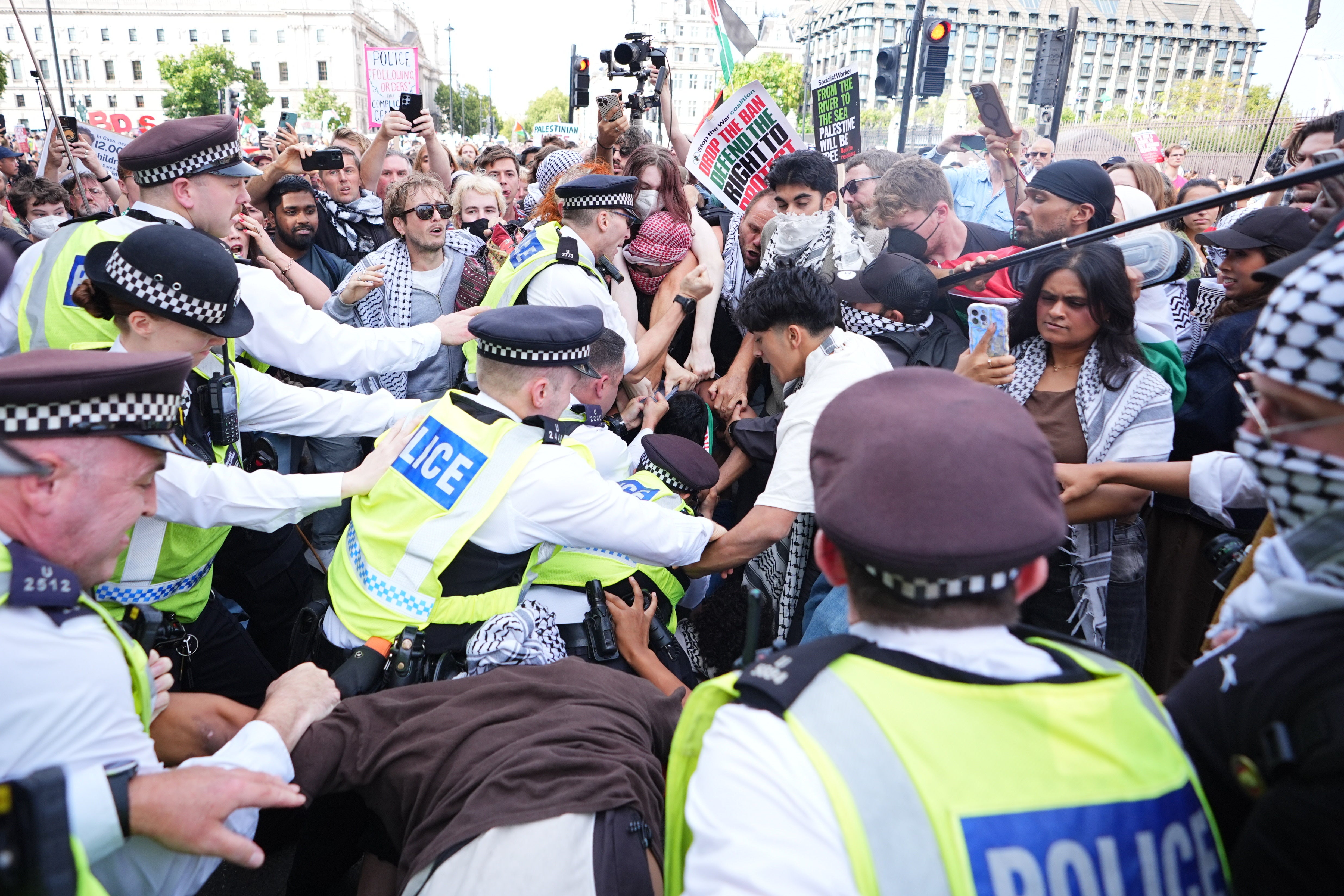 Police scuffle with protesters at the demonstration in Parliament Square