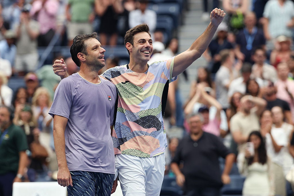 Horacio Zeballos celebrates with Marcel Granollers after winning the second match point