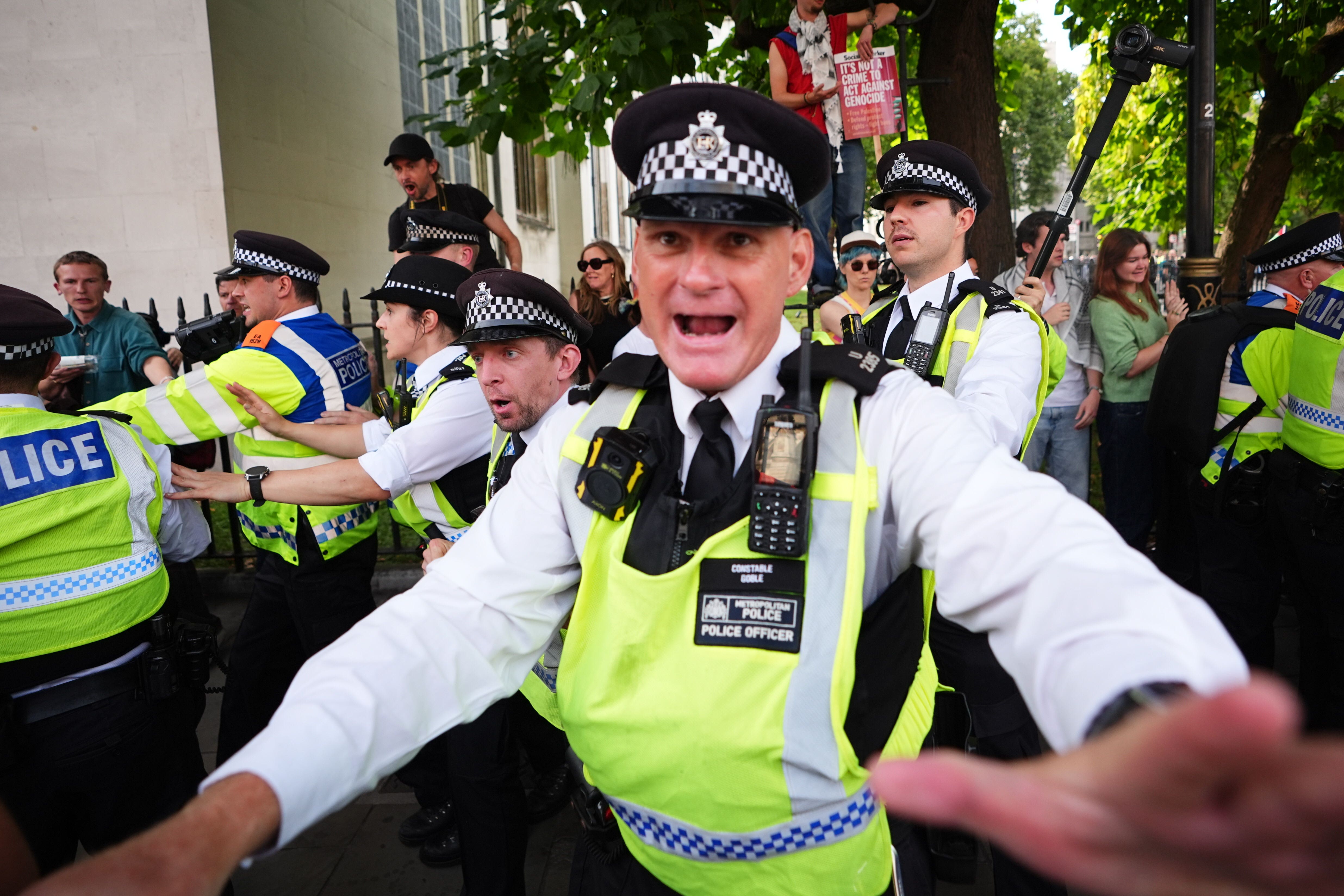 Police officers at the protest after the ban came into effect