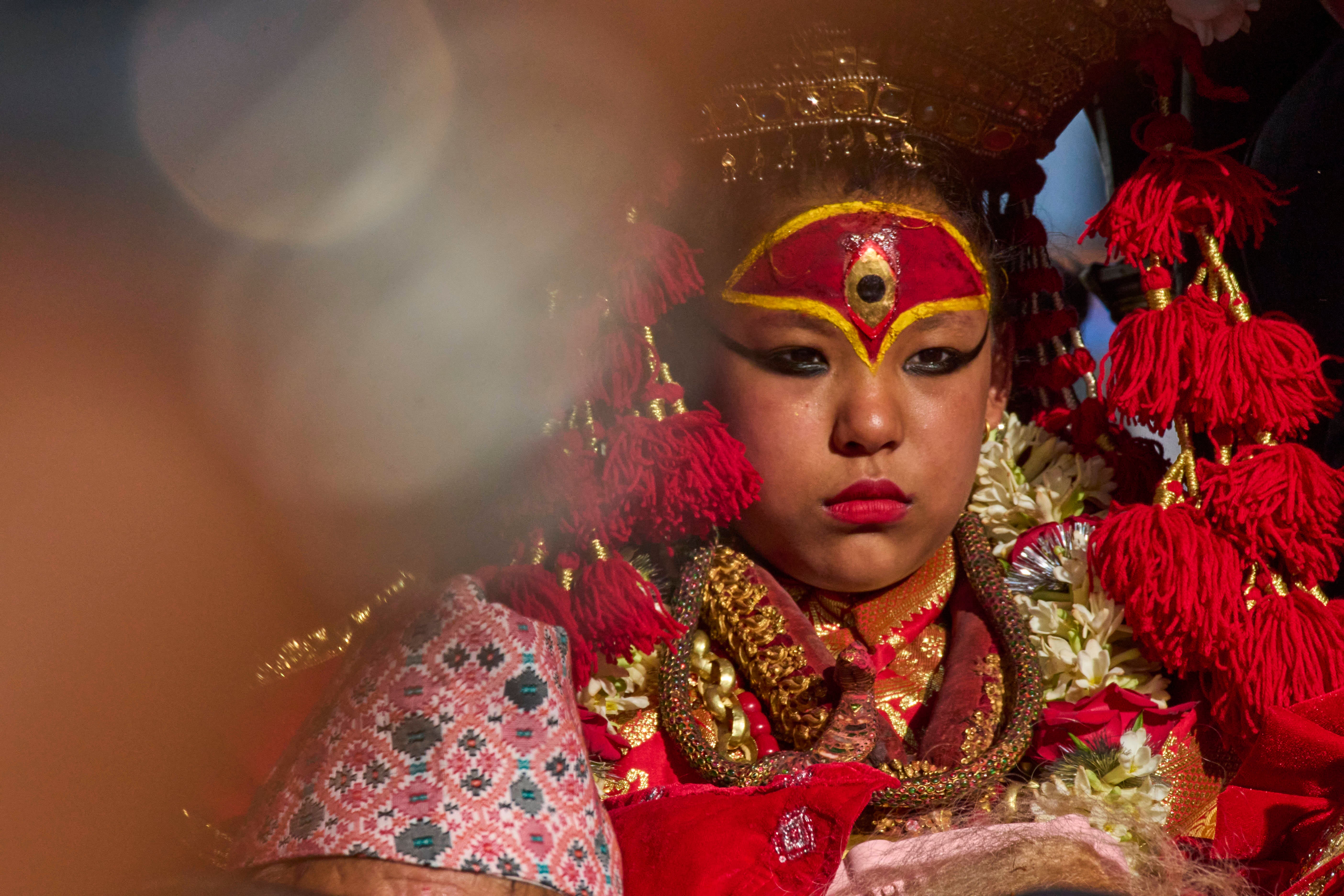 Living goddess Kumari is seen sitting inside the chariot during Indra Jatra, a festival that marks the end of the rainy season in Kathmandu, Nepal