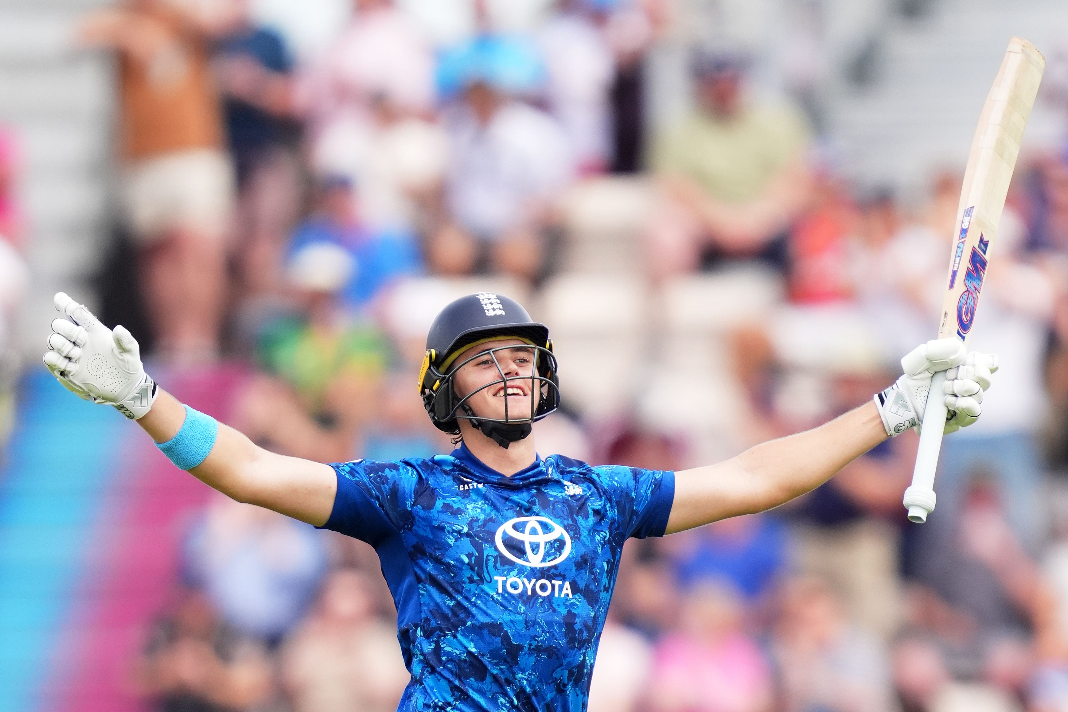 Jacob Bethell celebrates hitting a century (Adam Davy/PA)