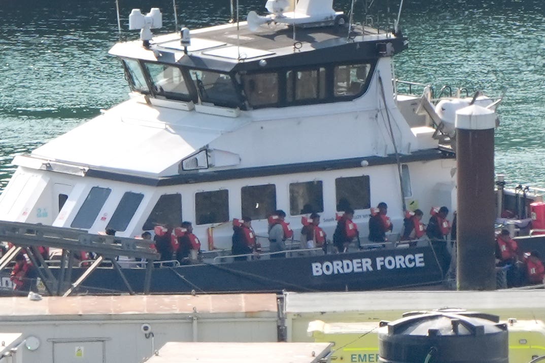 A group of people thought to be migrants are brought in to the Border Force compound in Dover, Kent (Gareth Fuller/PA)